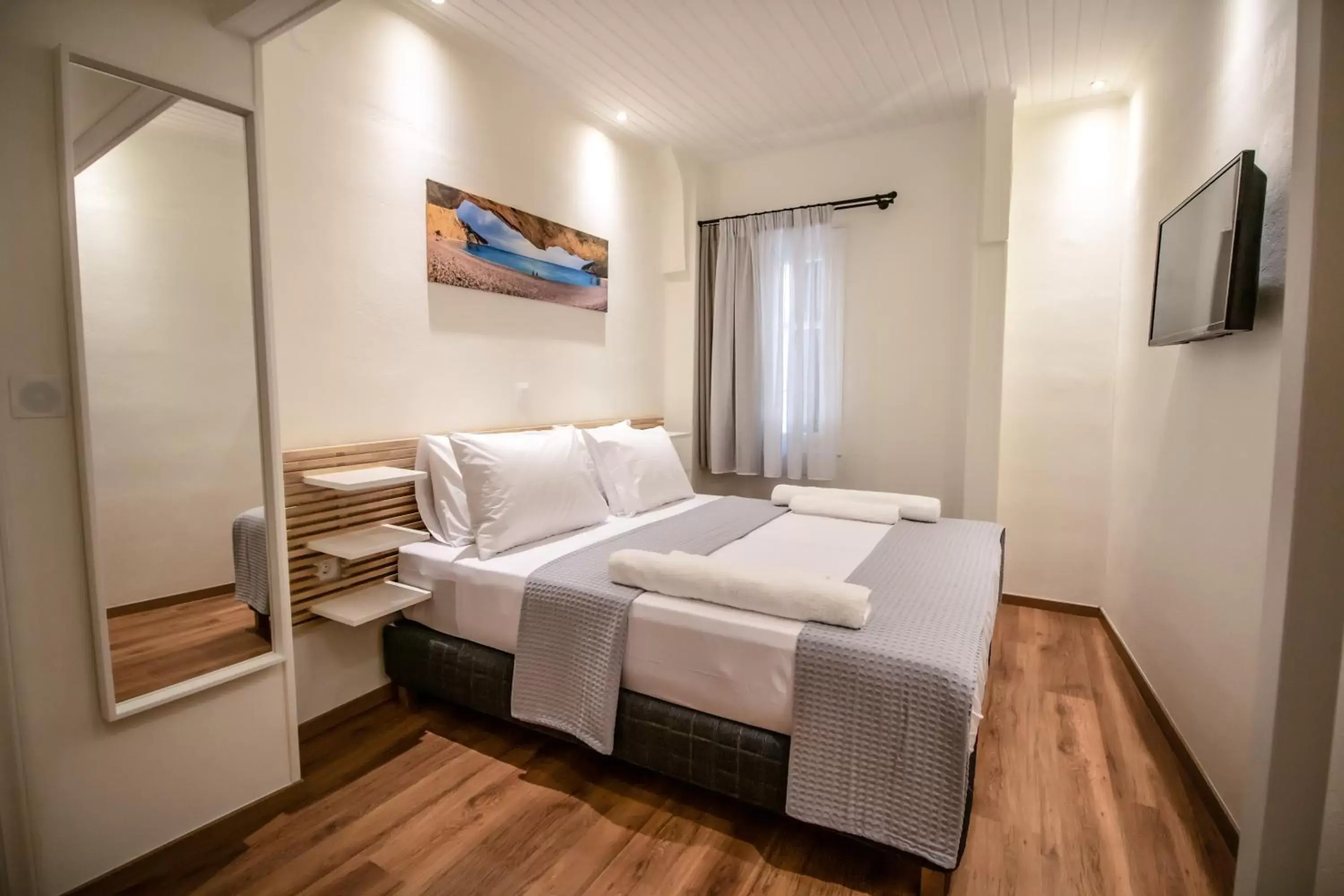 Bed in Levkosh Apartments at Lefkada's Heart