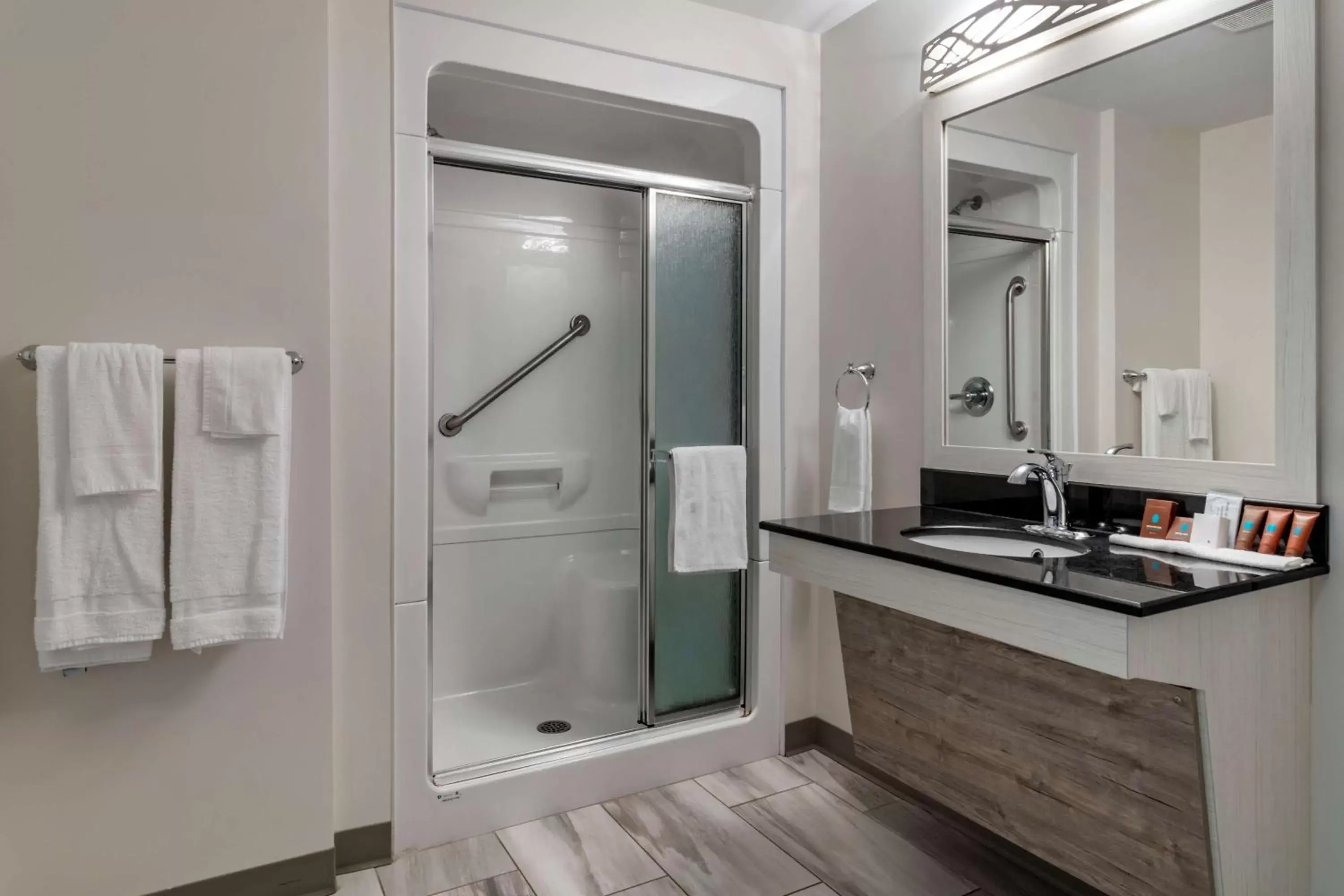 Bathroom in Dannys Hotel Suites; SureStay Collection by Best Western