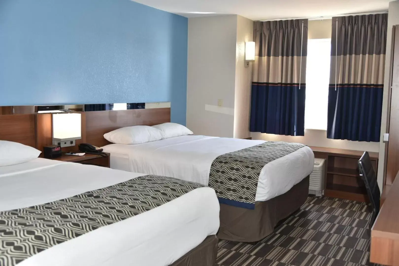 Bed in Microtel Inn & Suites by Wyndham Fond Du Lac