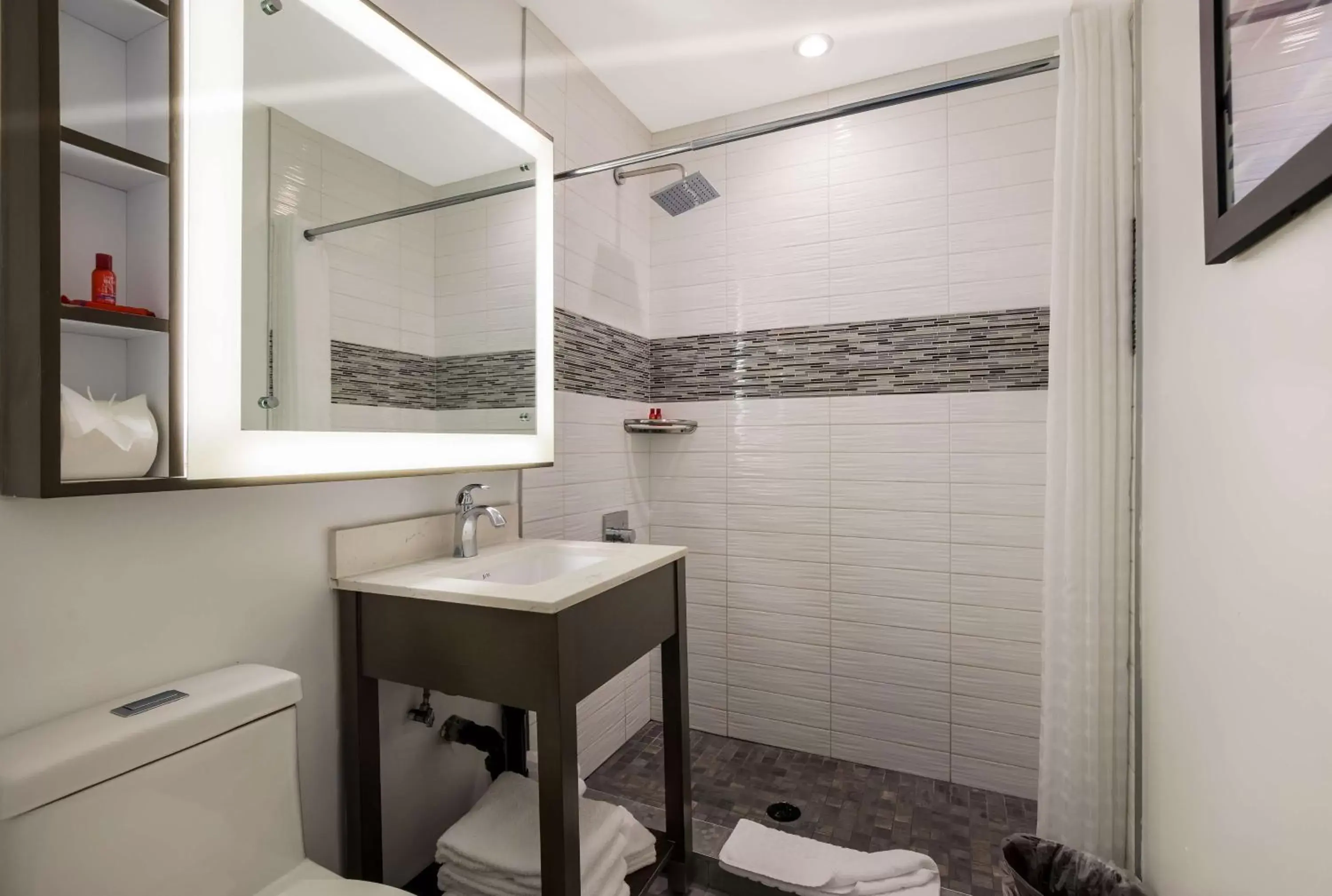 Bathroom in Sunset West Hotel, SureStay Collection By Best Western