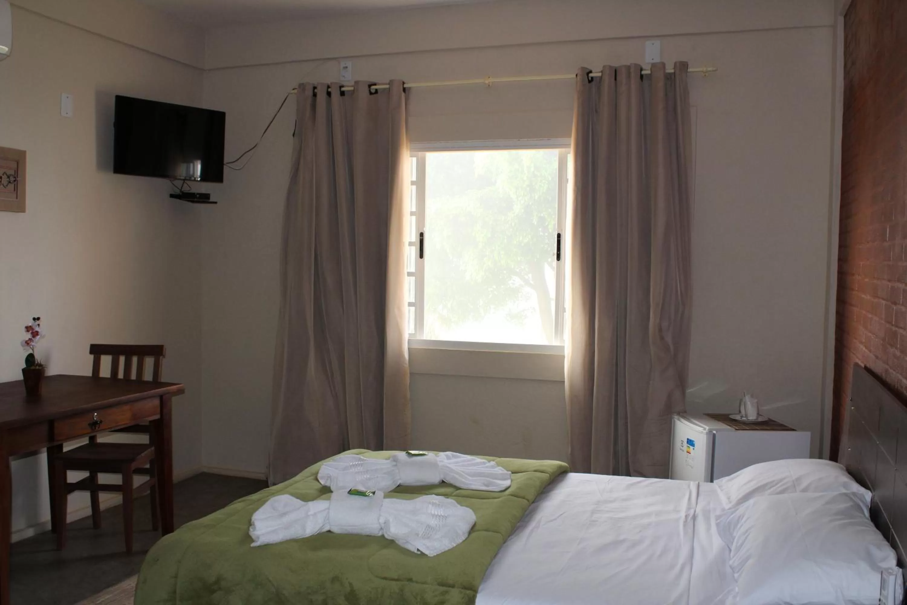 Bed in Pousada Morro dos Ventos