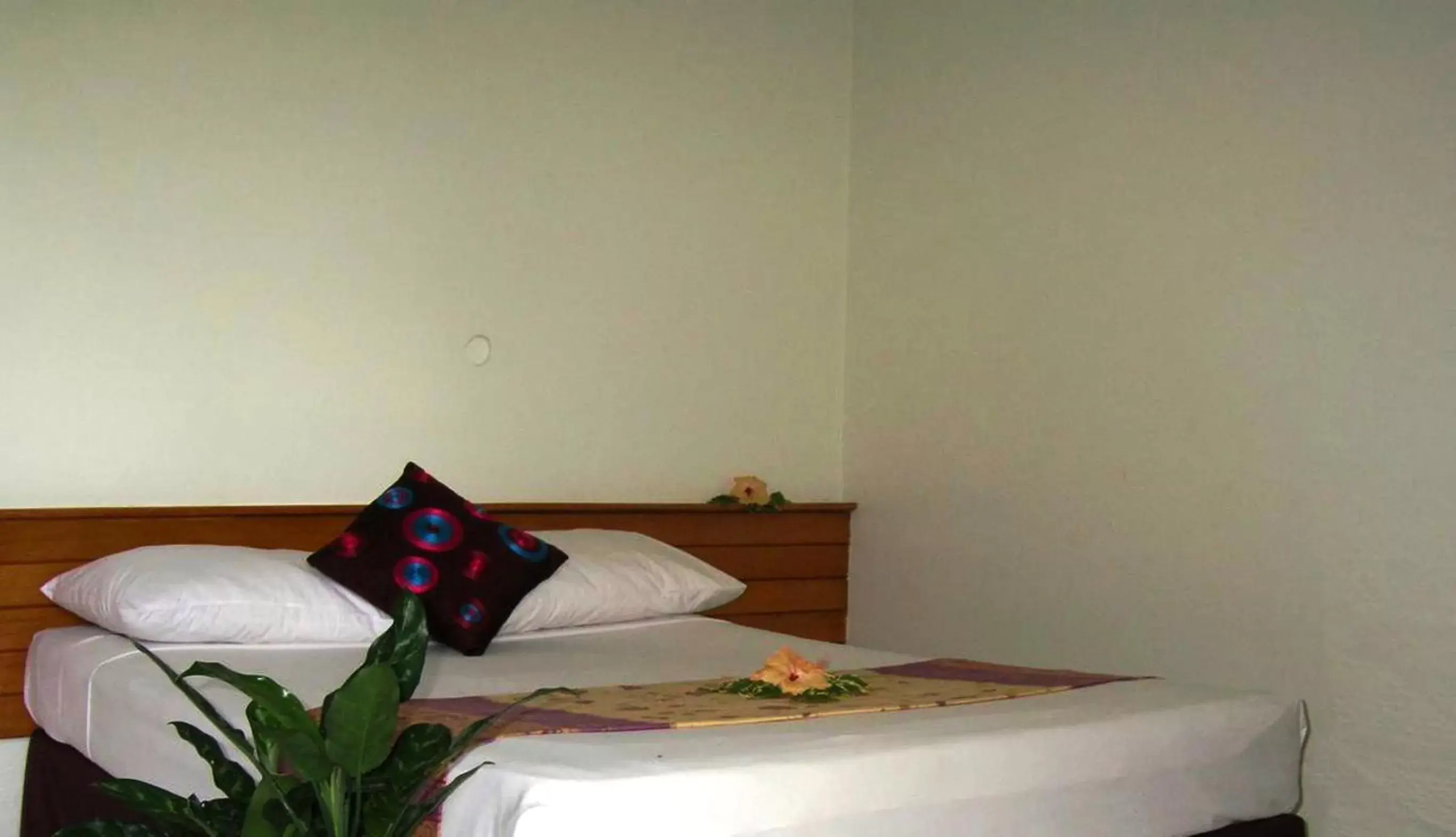 Bed in Hexagon International Hotel, Villas & Spa