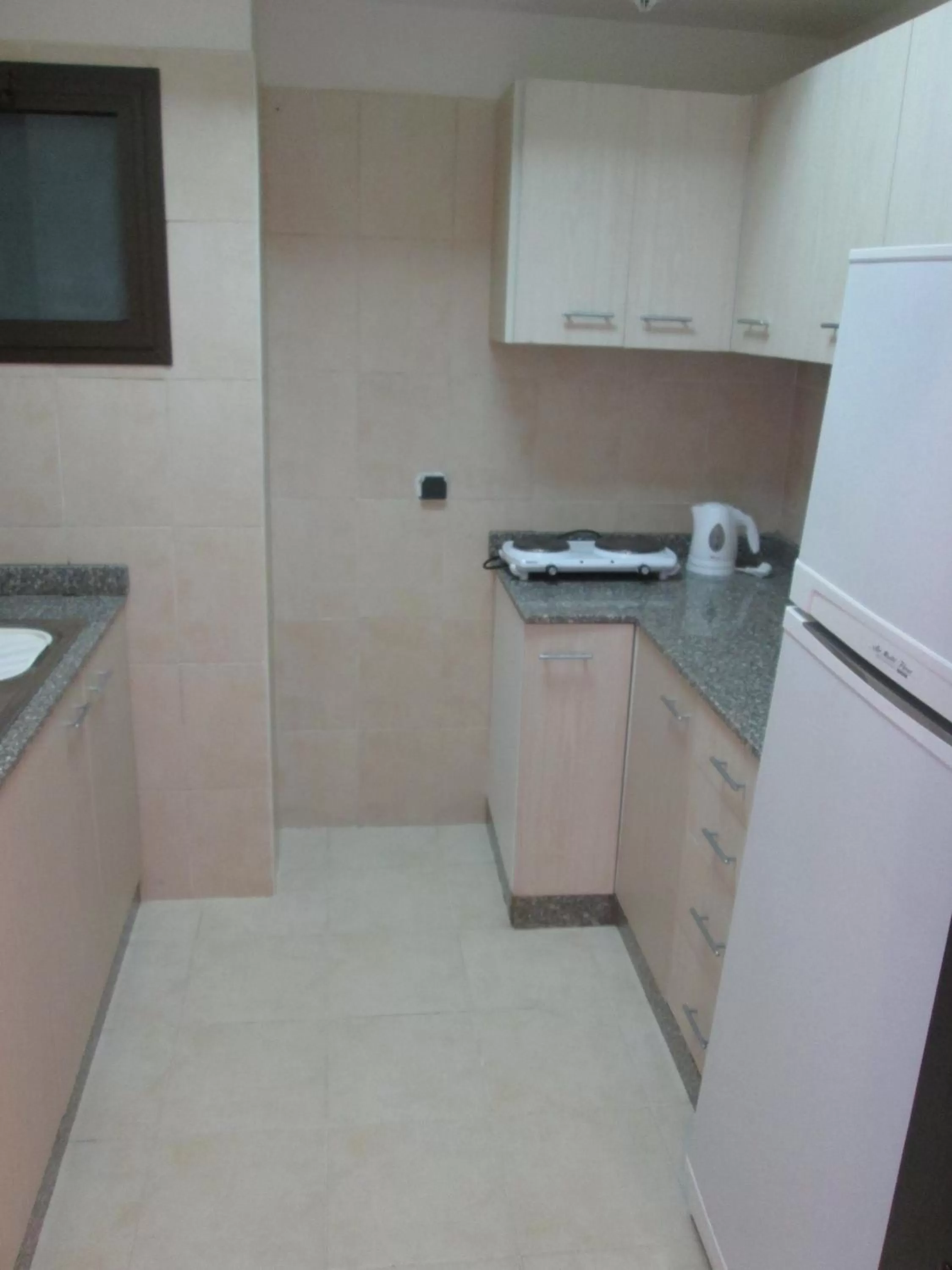 Kitchen or kitchenette in Solymar Ivory Suites