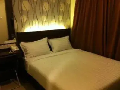 Bed in The Regency Garden Hotel