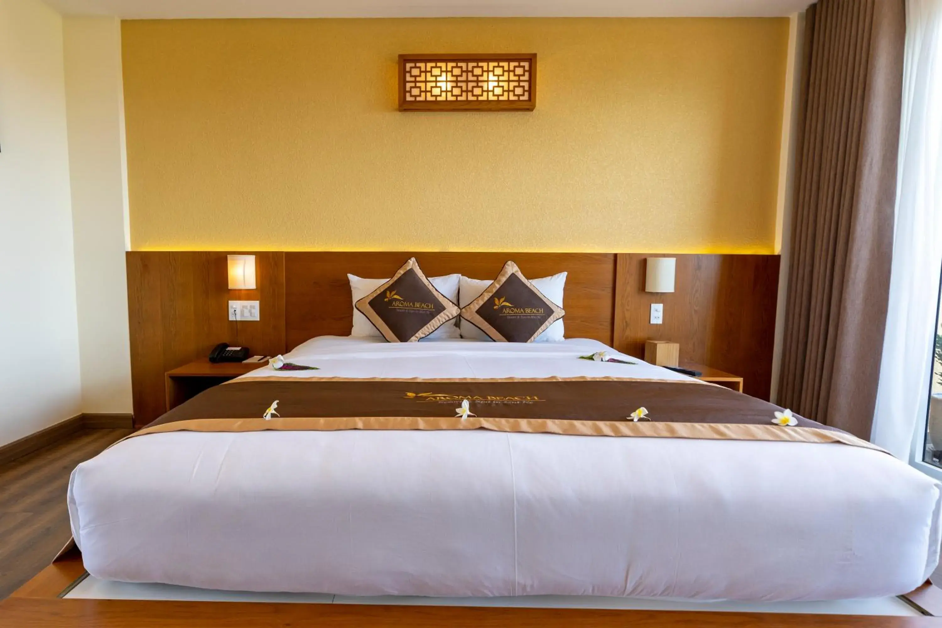 Bed in Aroma Beach Resort and Spa
