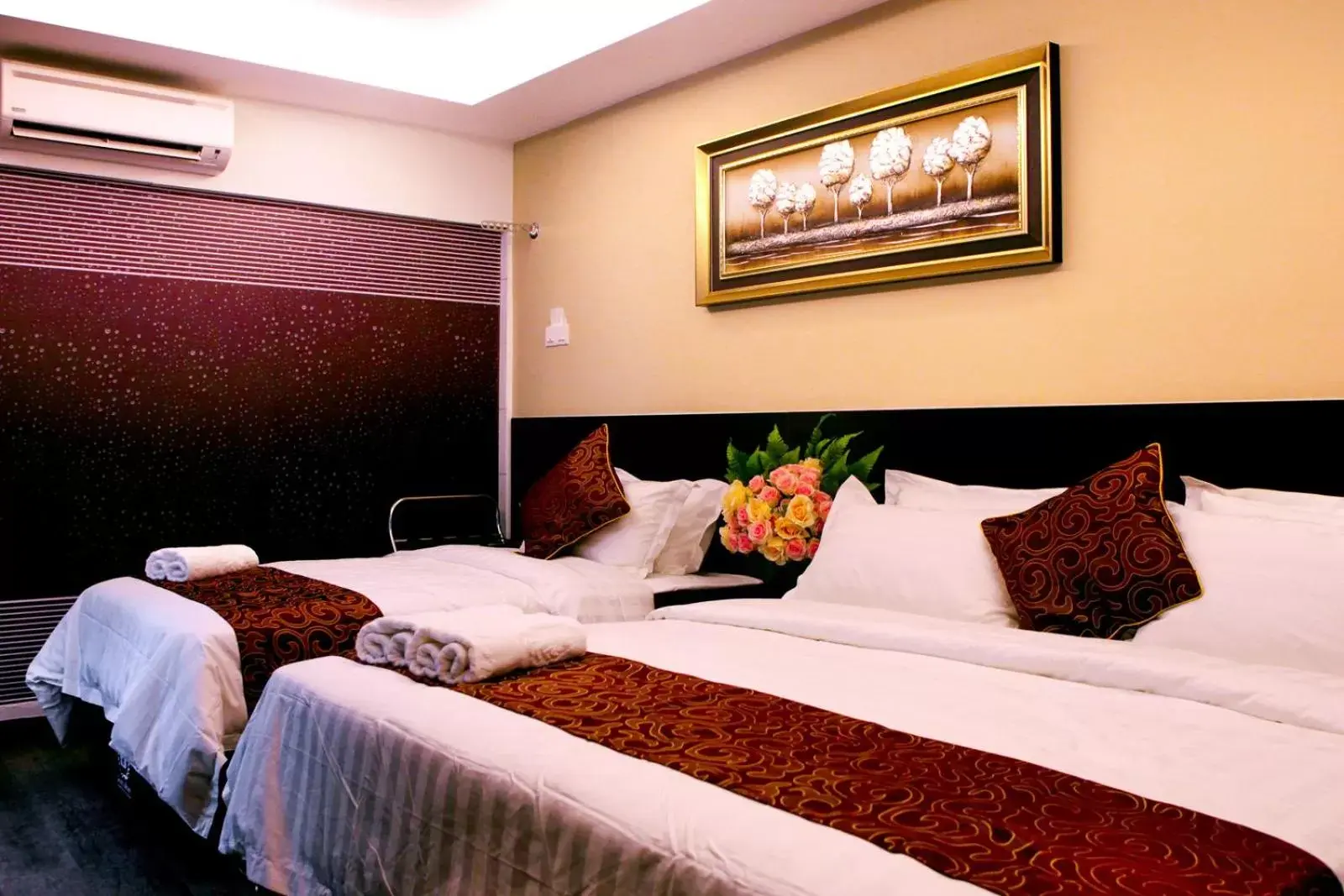 Bed in J Suites Hotel