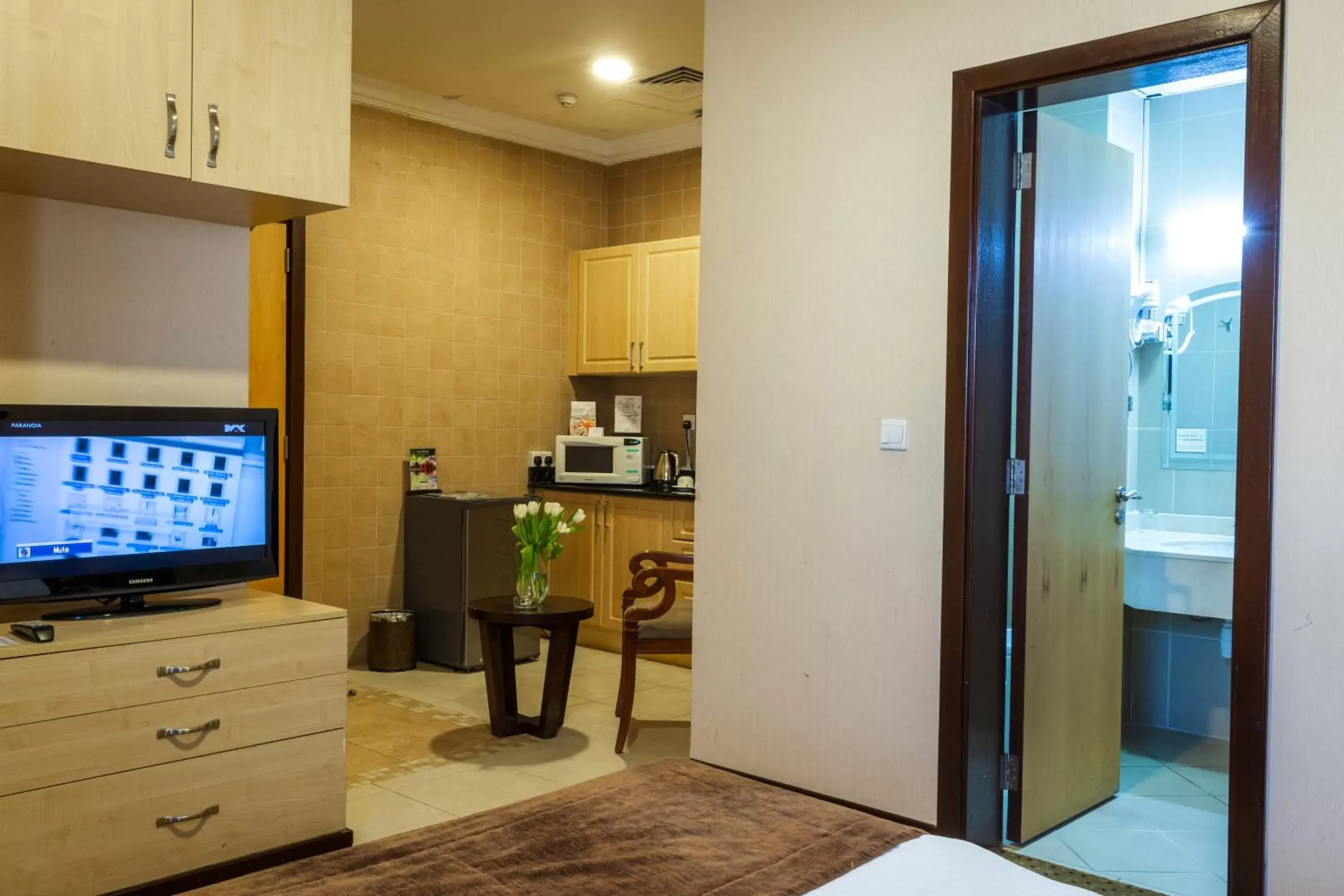 TV and multimedia, TV/Entertainment Center in Kingsgate Hotel Doha by Millennium Hotels.