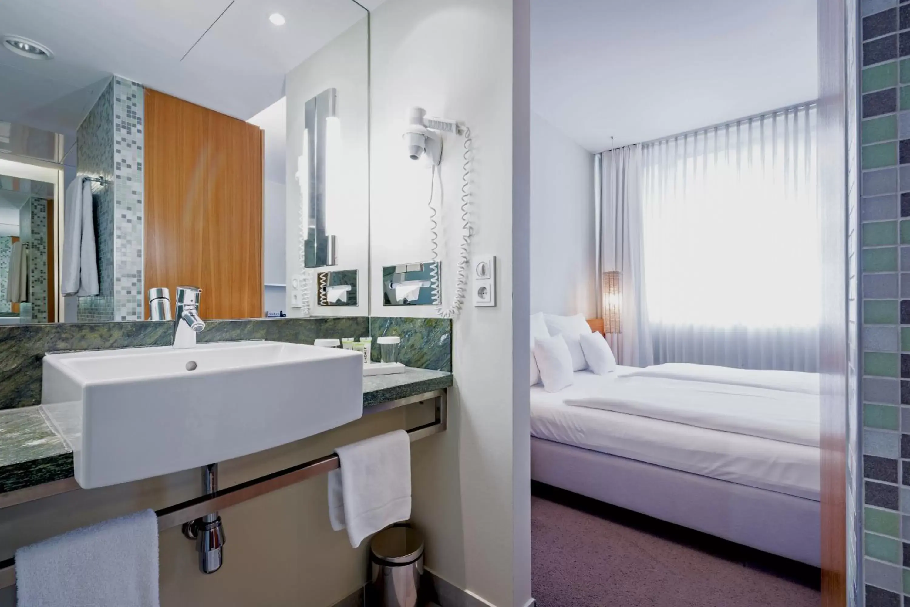 Bed in Lindner Hotel Berlin Ku'damm, part of JdV by Hyatt Bed in Lindner Hotel Berlin Ku'damm, part of JdV by Hyatt