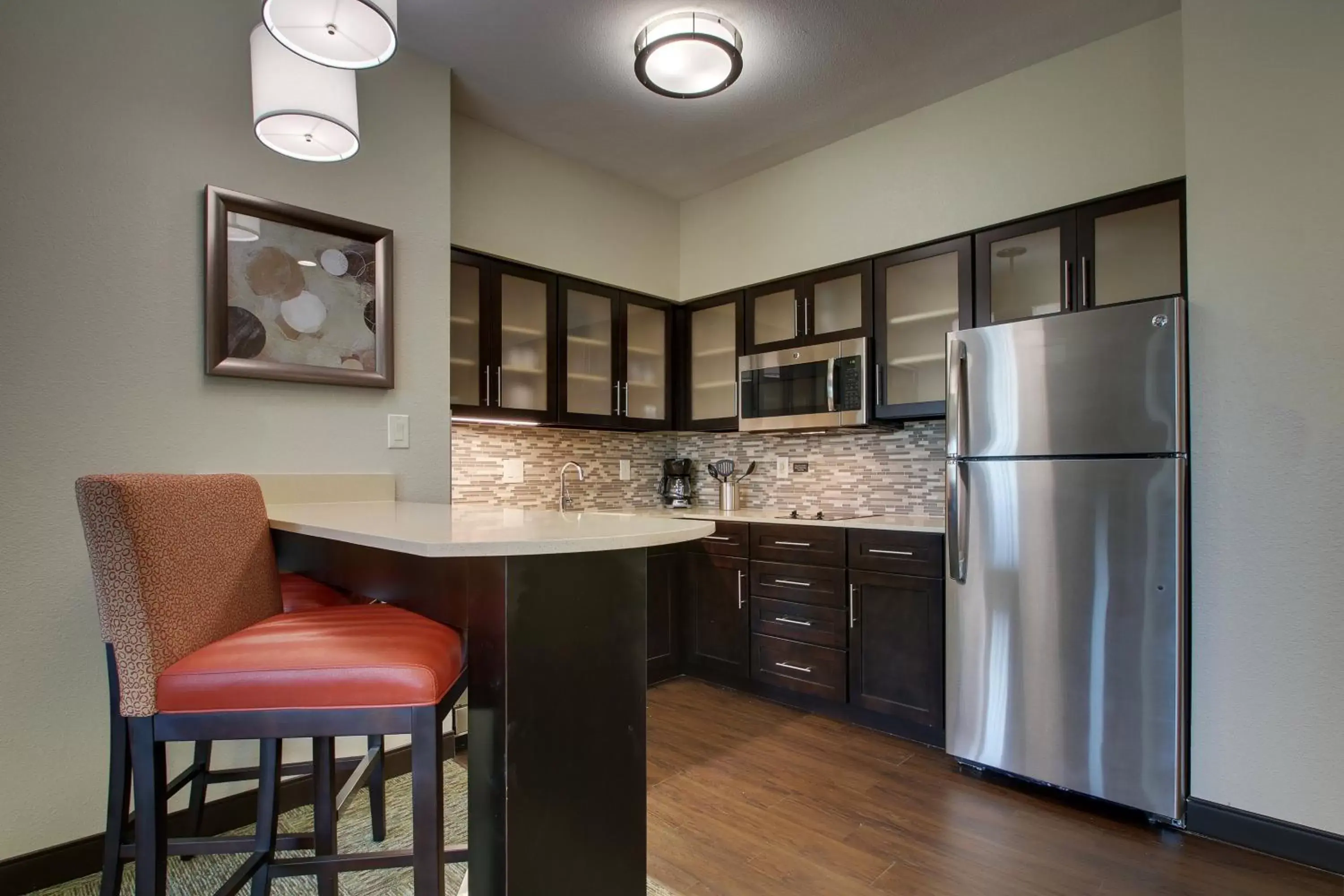 Photo of the whole room, Kitchen/Kitchenette in Staybridge Suites Plano - The Colony, an IHG Hotel