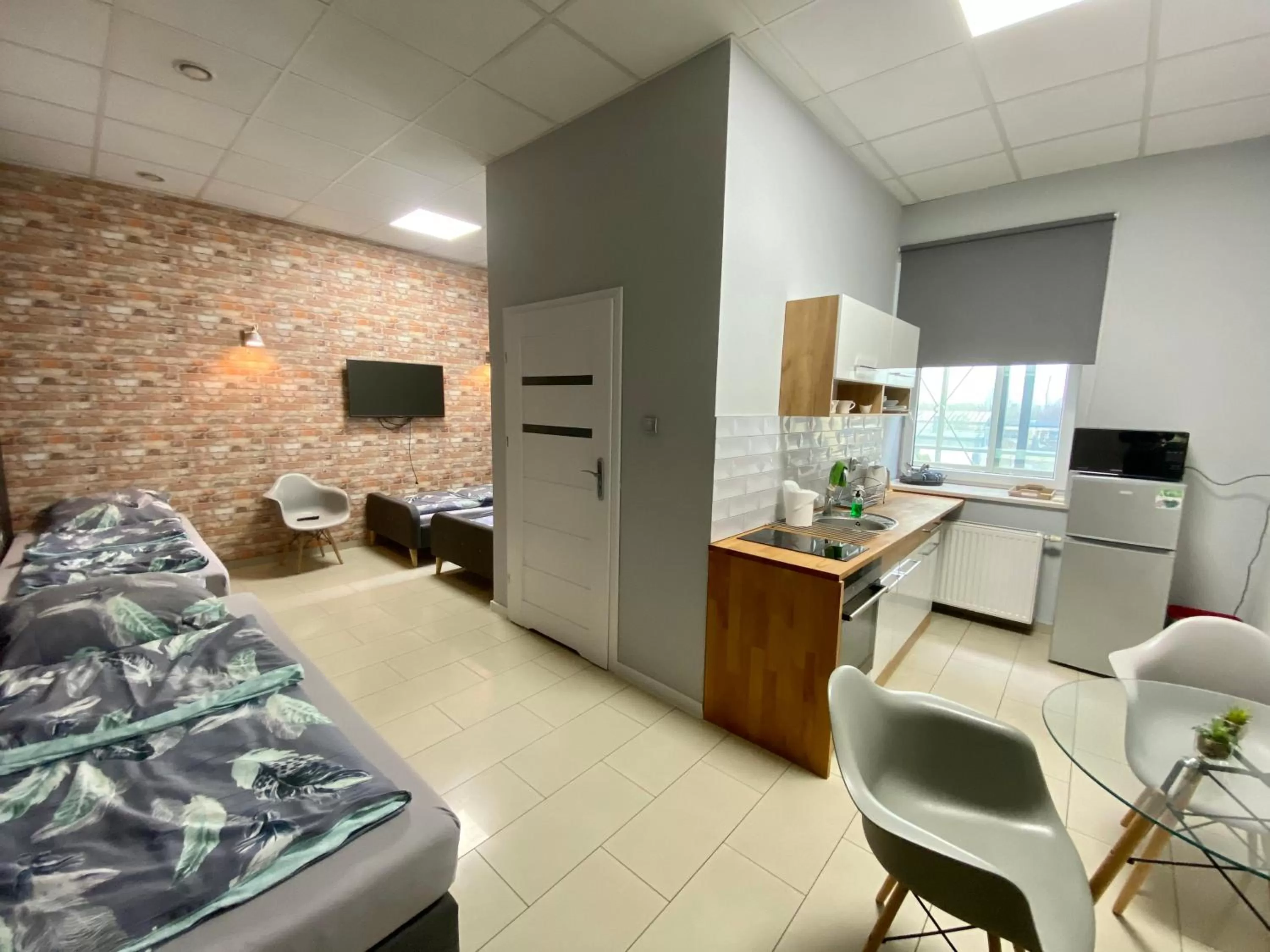 Kitchen or kitchenette, Bed in Apartamenty i pokoje „Pod Jedynką”