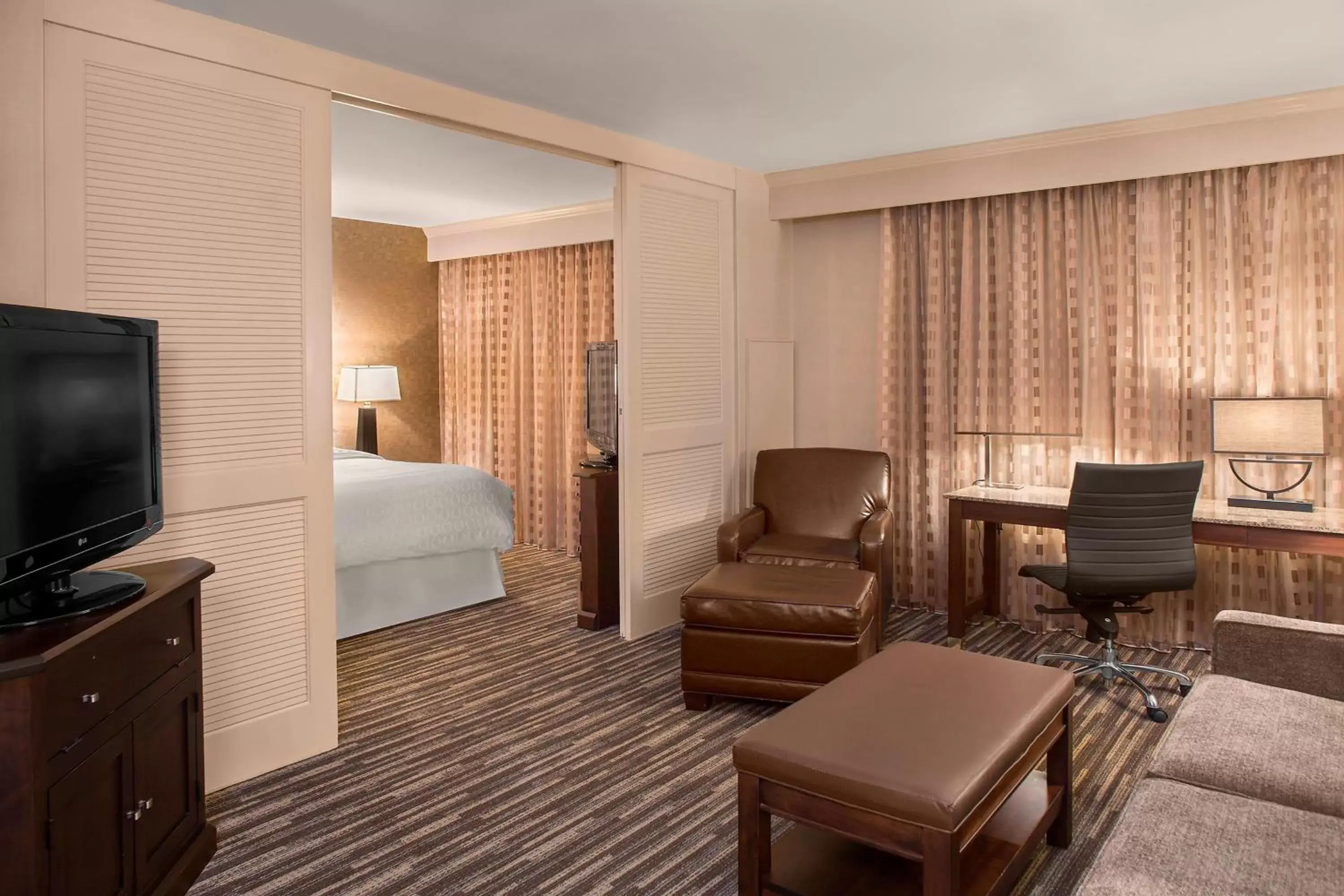 Bedroom, Seating Area in Sheraton Suites Akron Cuyahoga Falls