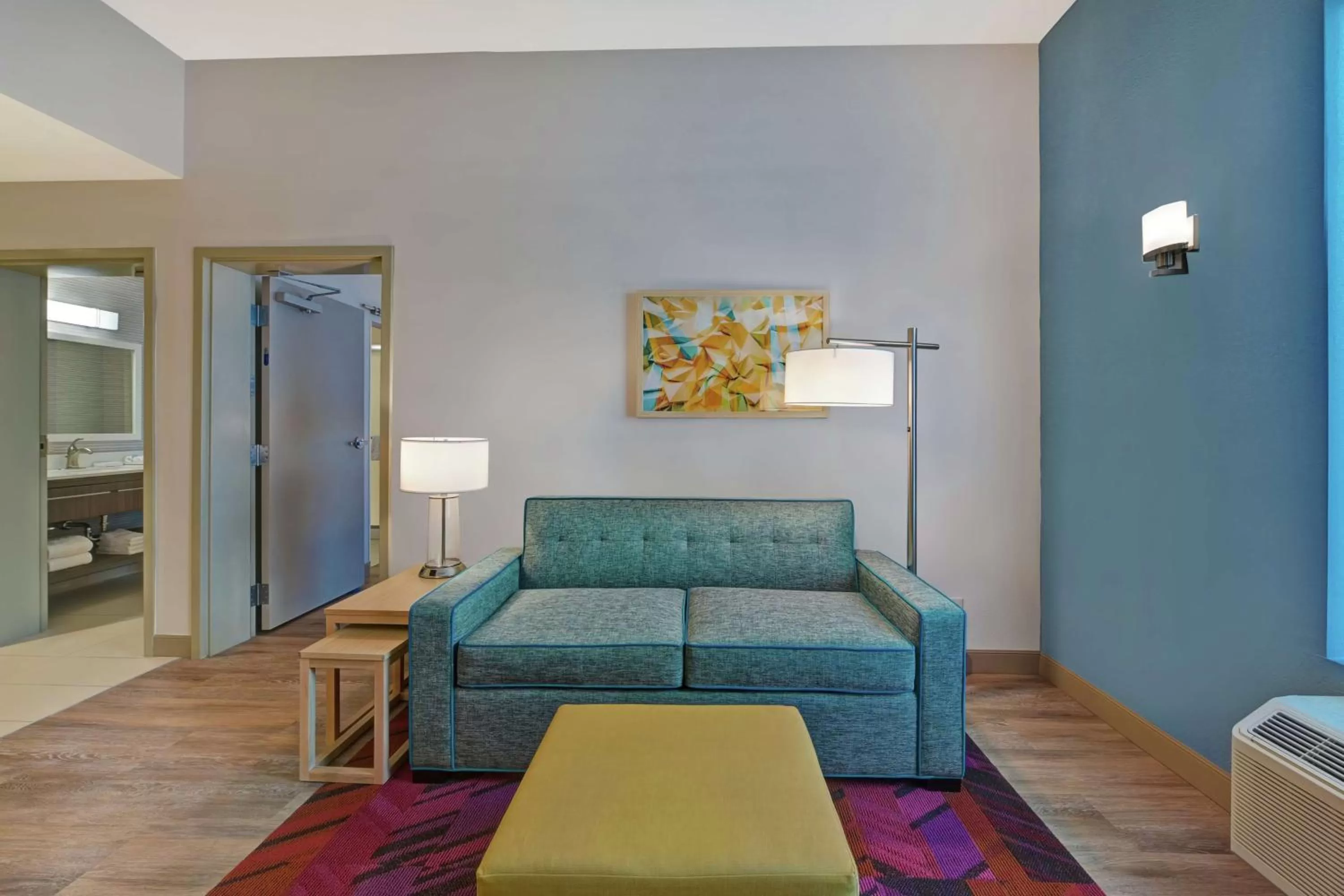 Living room, Bed in Home2 Suites By Hilton West Palm Beach Airport