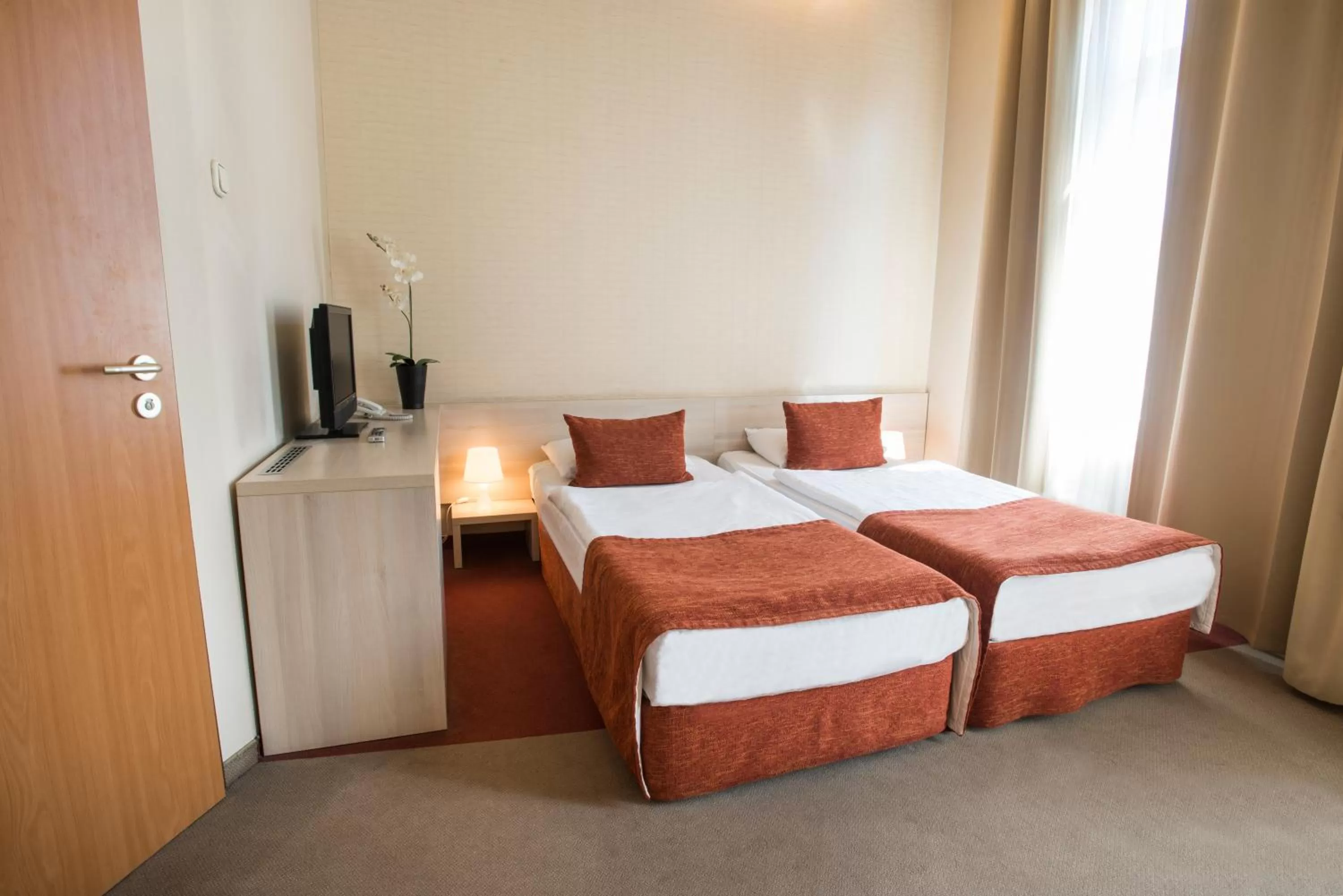 Bed in Star City Hotel