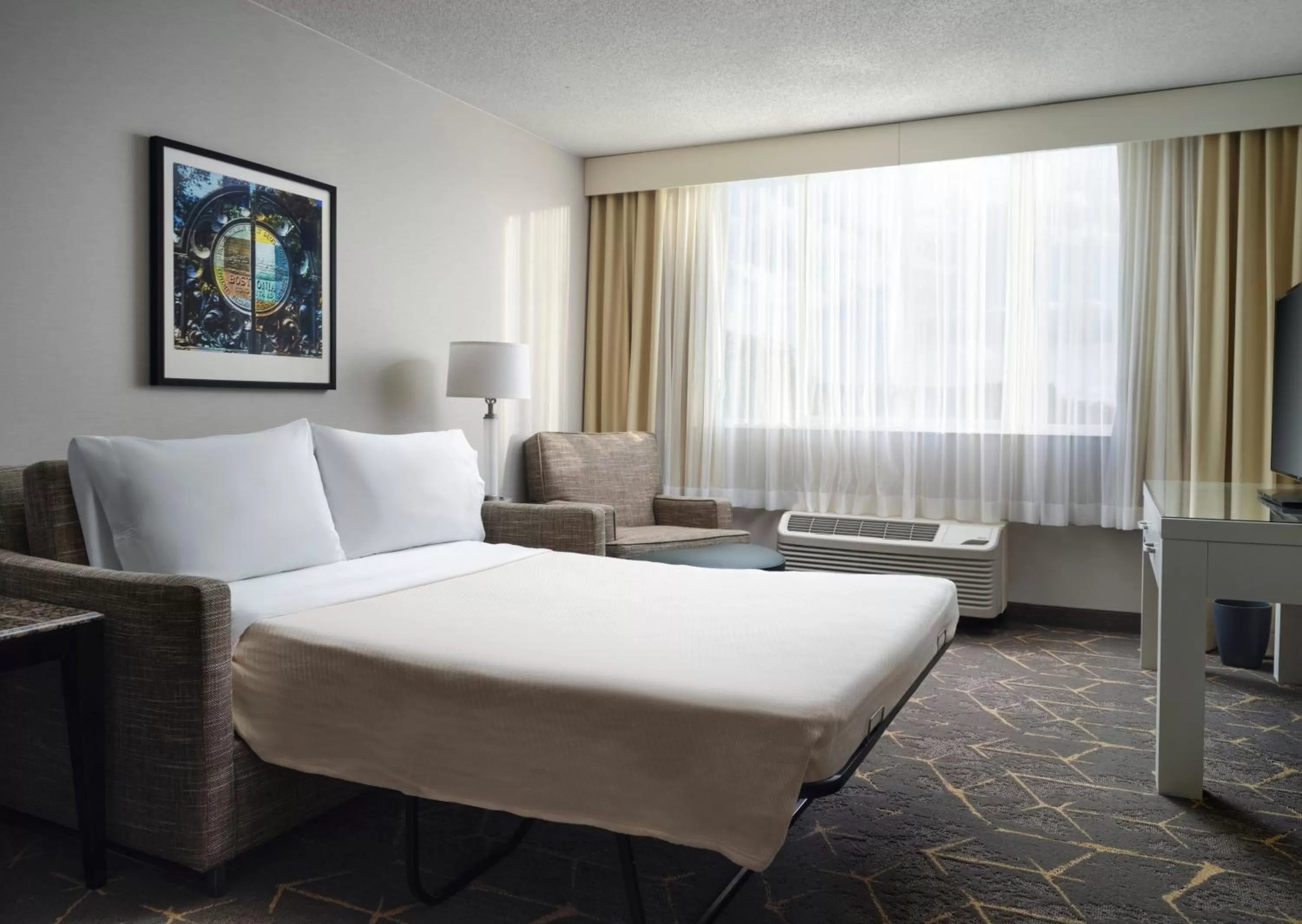 Living room, Bed in Holiday Inn & Suites Boston Peabody by IHG