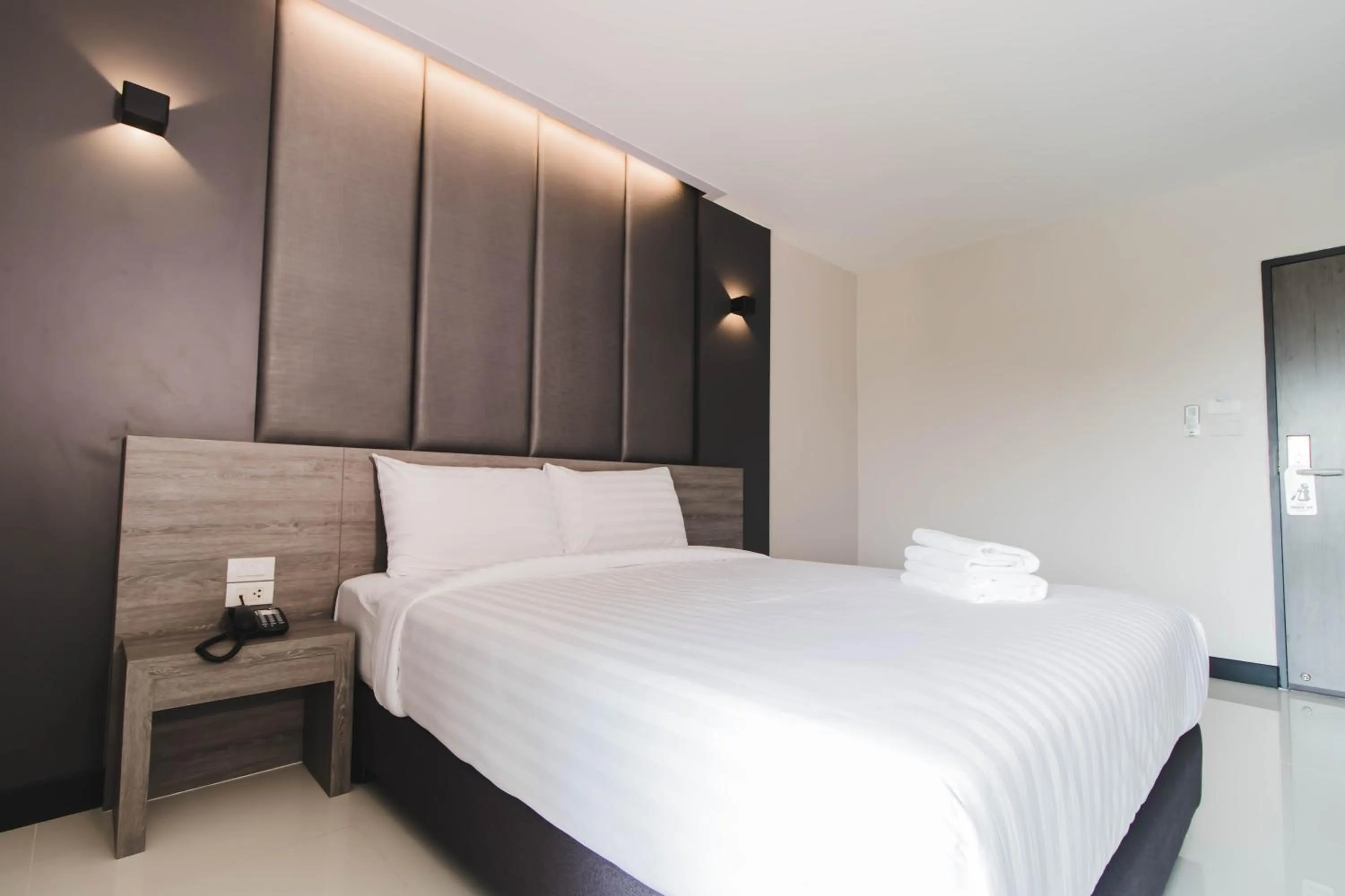 Bed in So good Hotel Bangkok