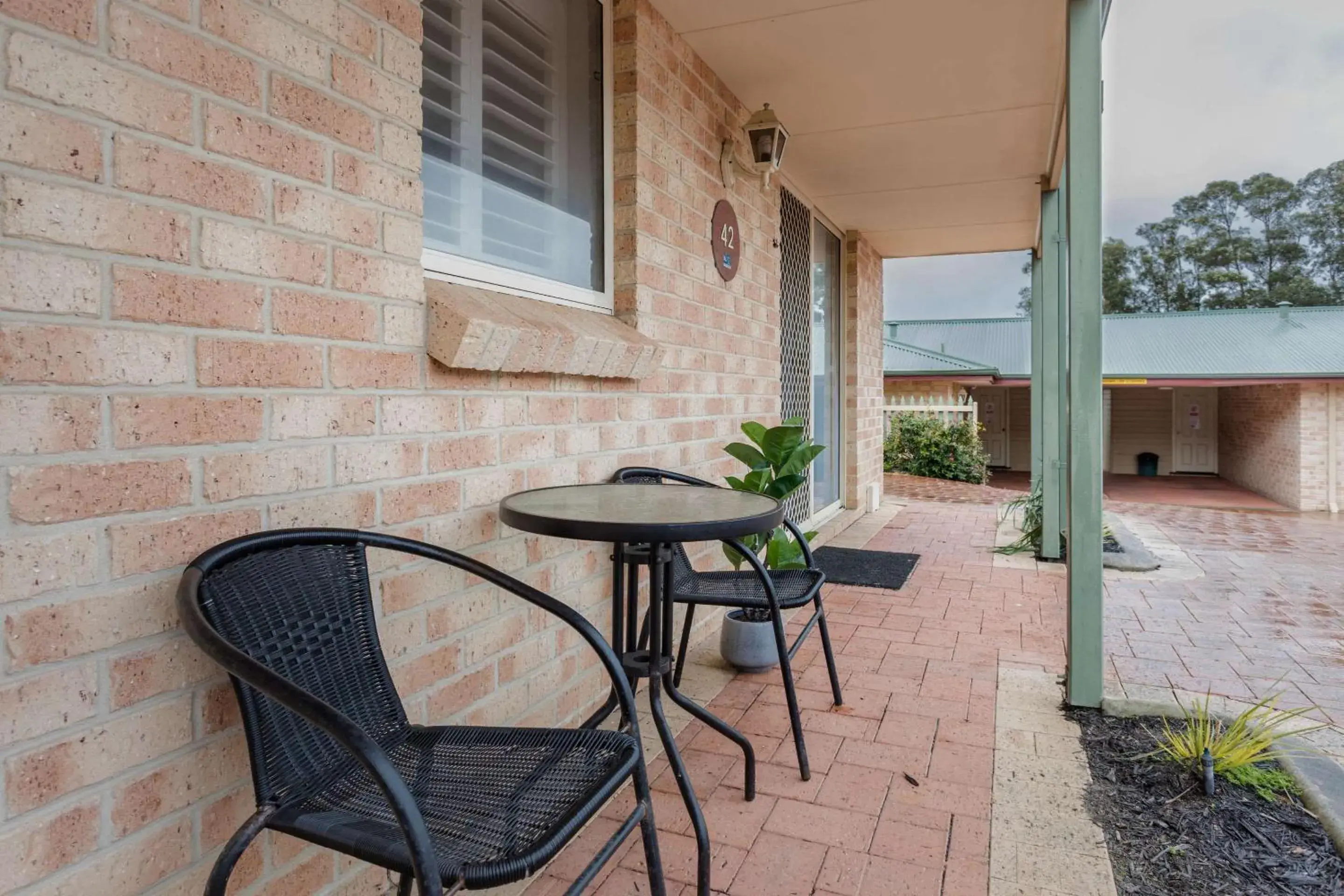 Bedroom, Patio/Outdoor Area in Quality Apartments Banksia Albany