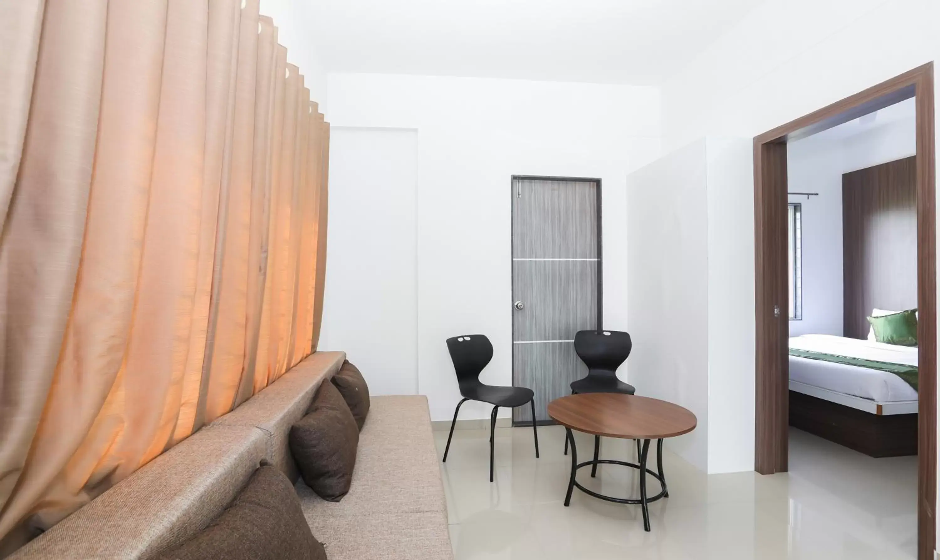 Seating area, Bed in Treebo Sapphire Studio Seating area, Bed in Treebo Sapphire Studio