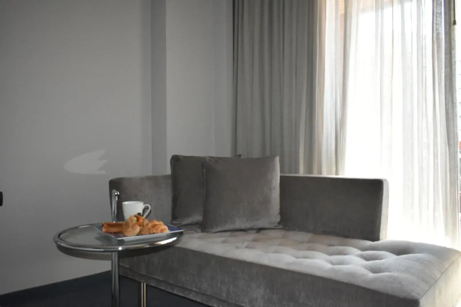 Seating area, Bed in ParkTower Suites Seating area, Bed in ParkTower Suites