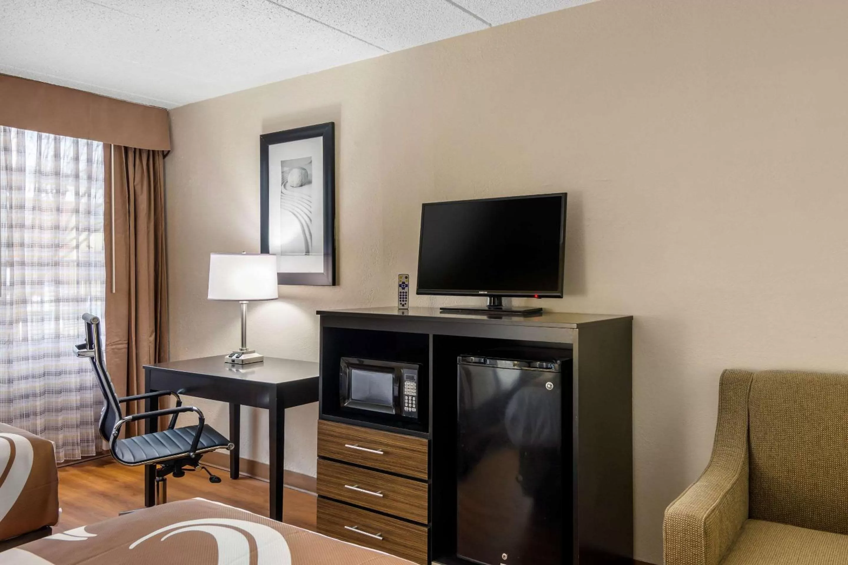 Photo of the whole room, TV/Entertainment Center in Quality Inn & Suites