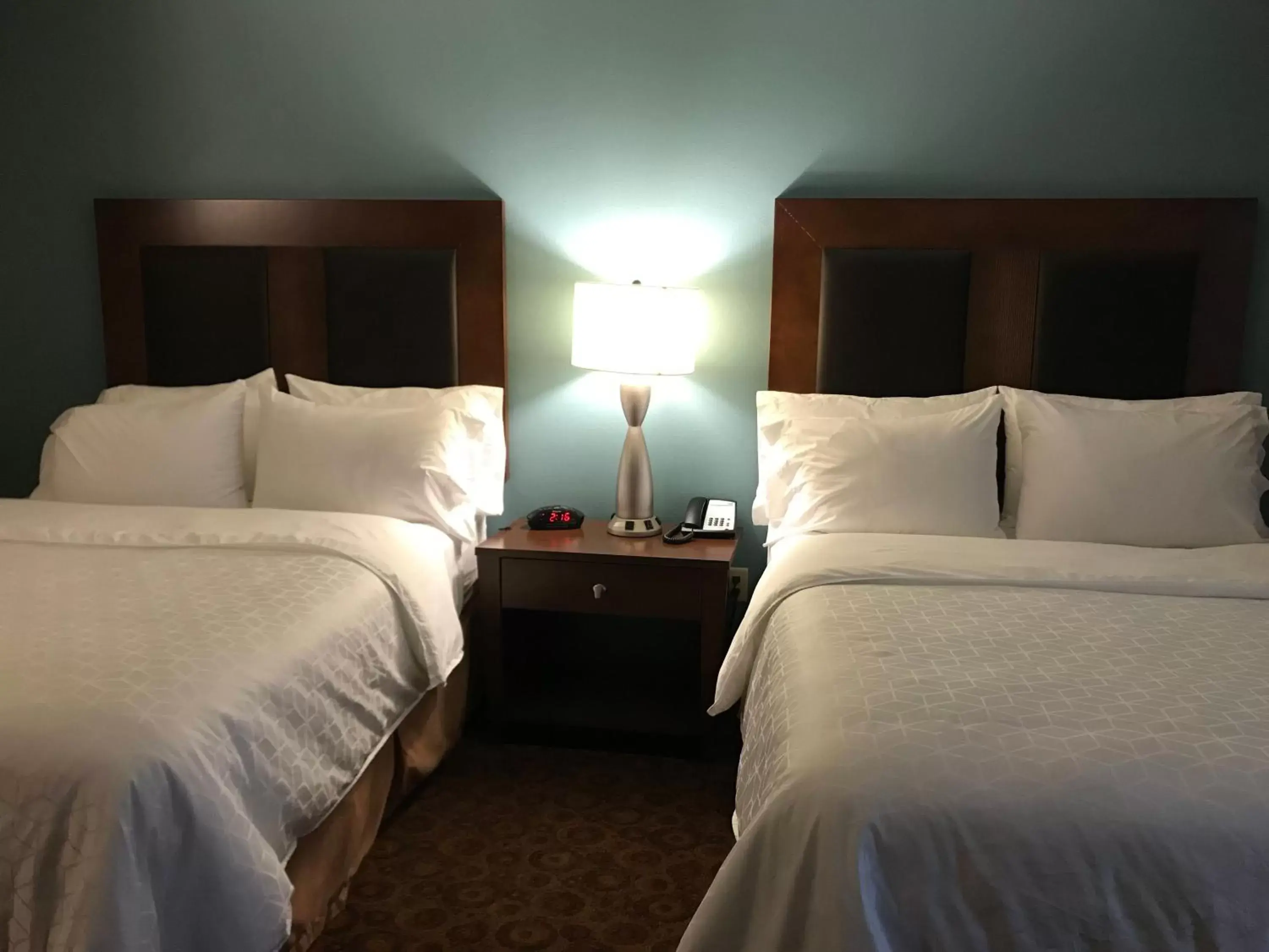 Bed in Holiday Inn Express and Suites St. Cloud, an IHG Hotel