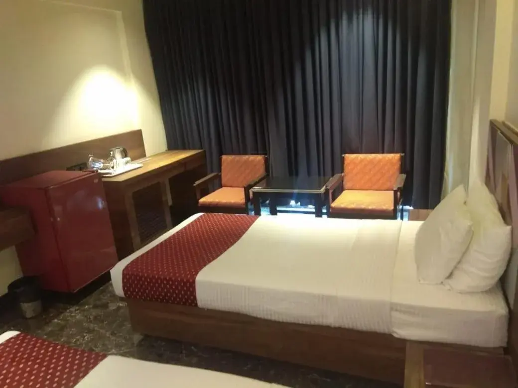 Bed in Quality Inn Regency, Nashik