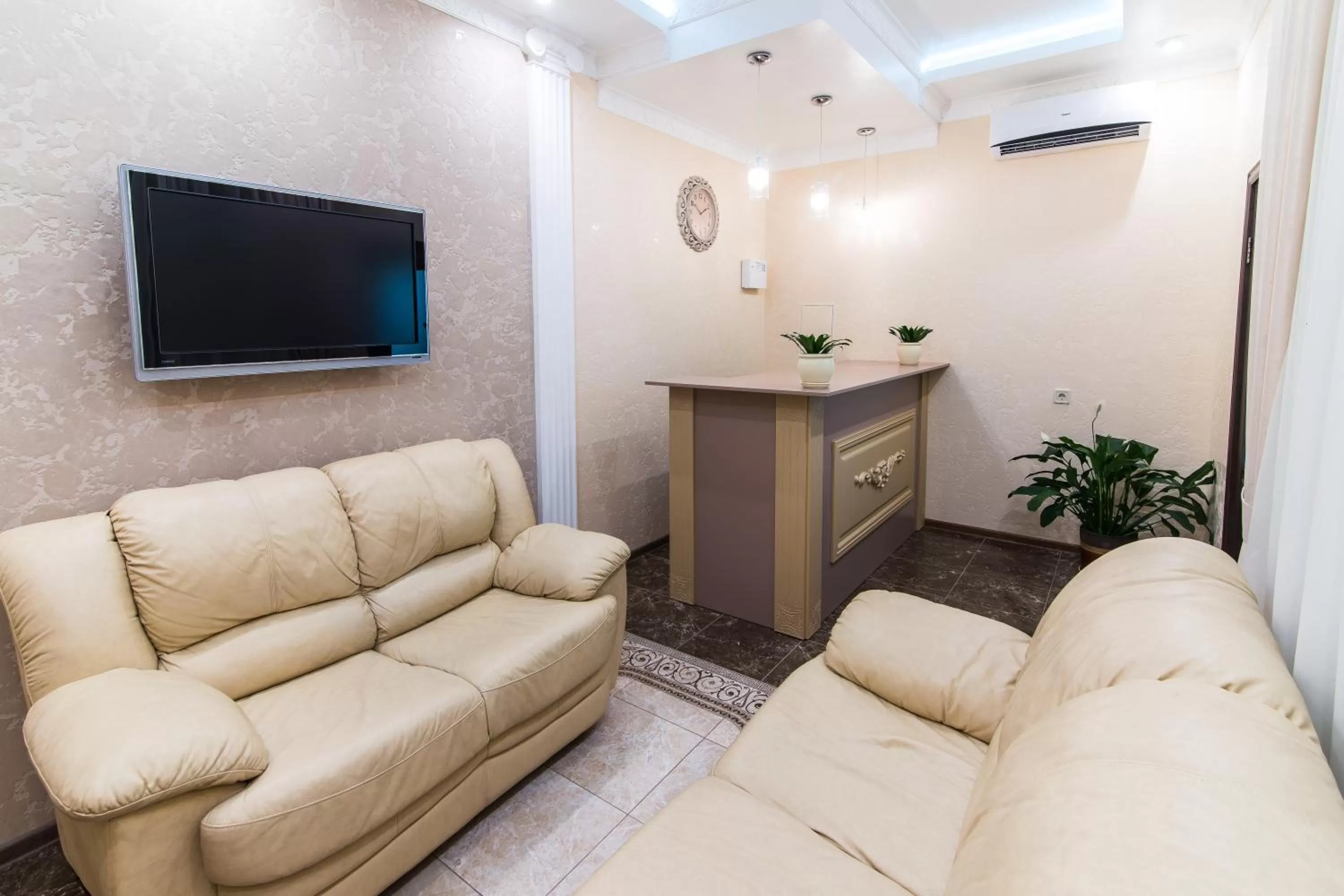 Communal lounge/ TV room in L.O.Y Family Hotel