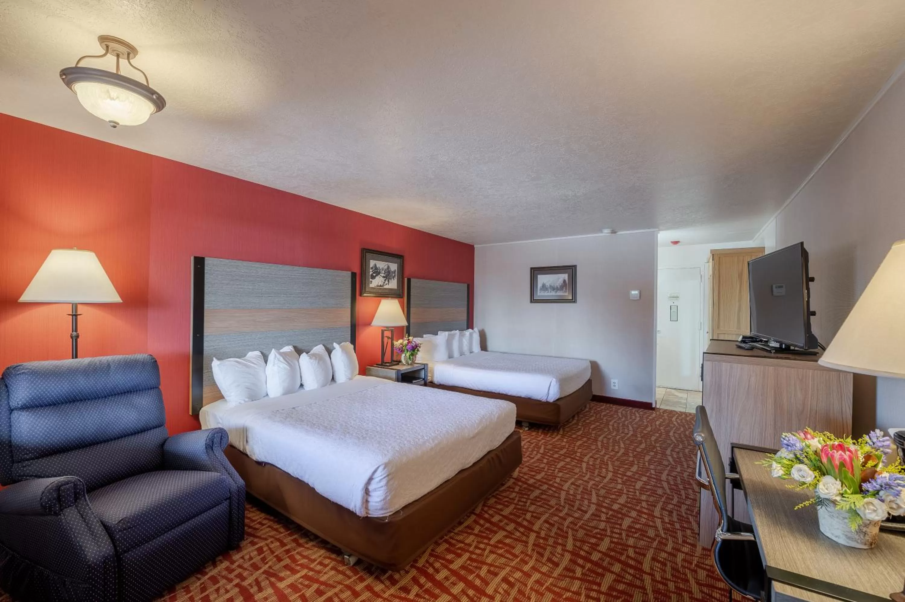 Bed in 49'er Inn & Suites