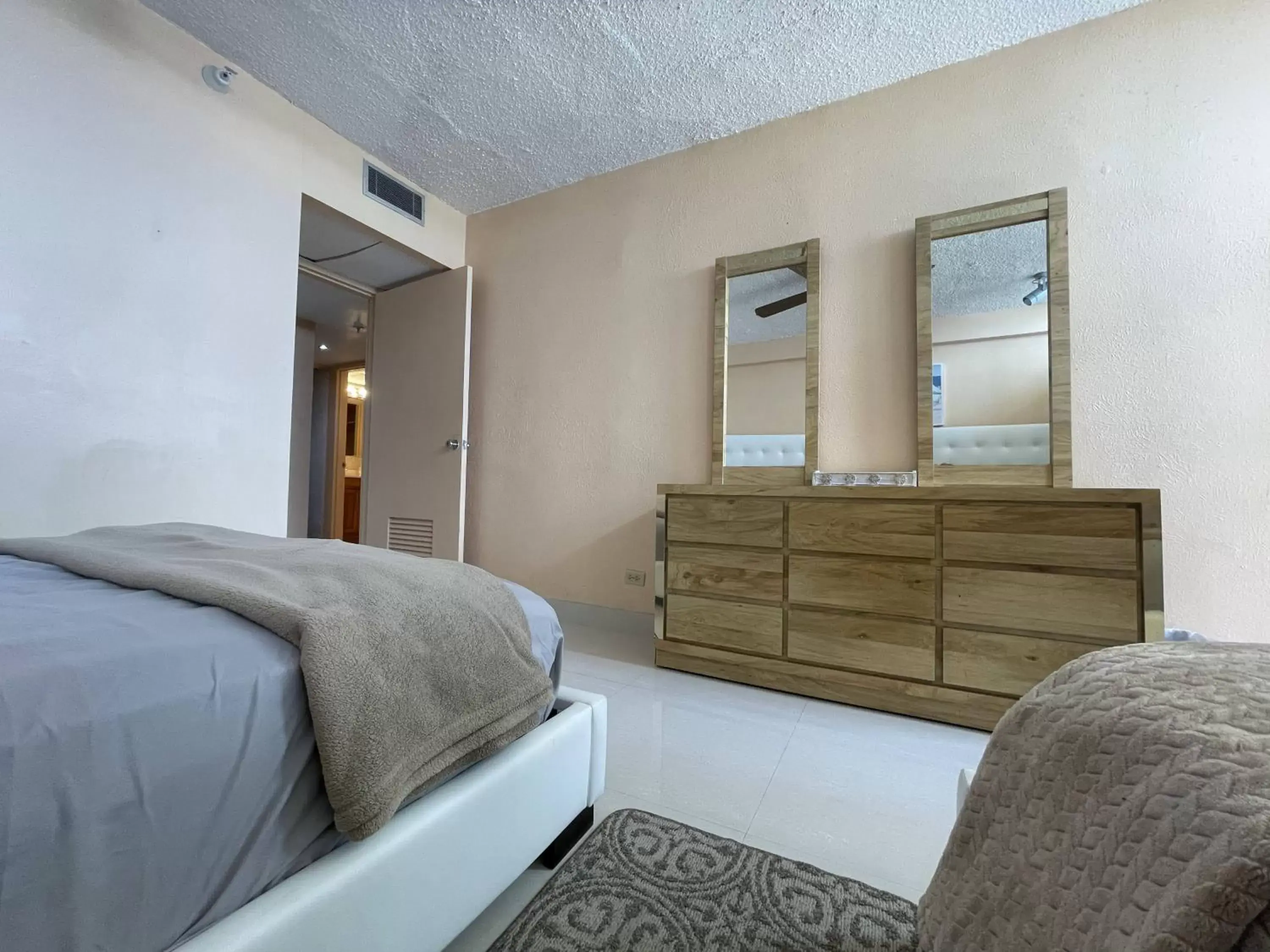 Bed in 2BR Condo at Isla Verde Beach