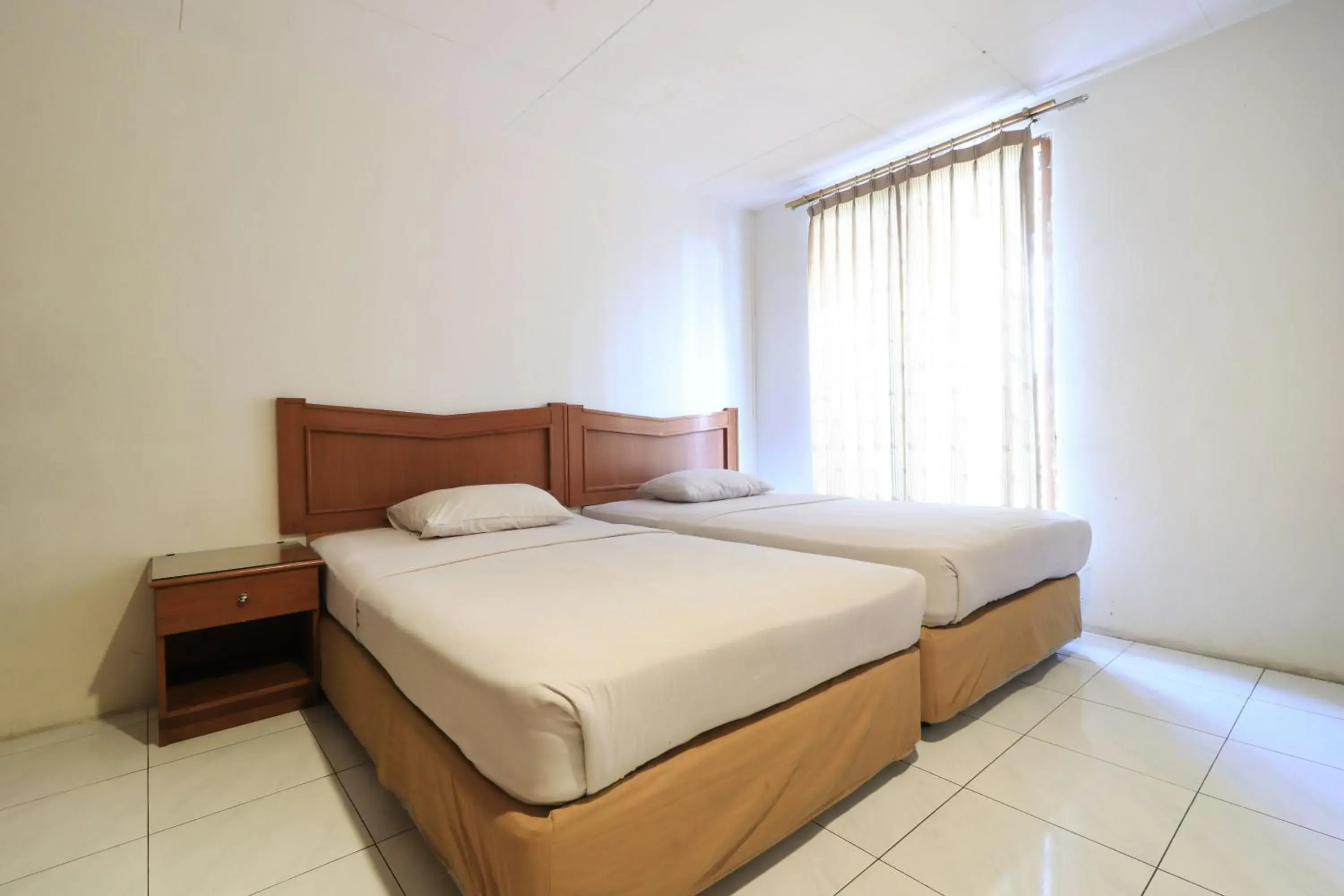 Photo of the whole room, Bed in Hotel Prapancha Jakarta