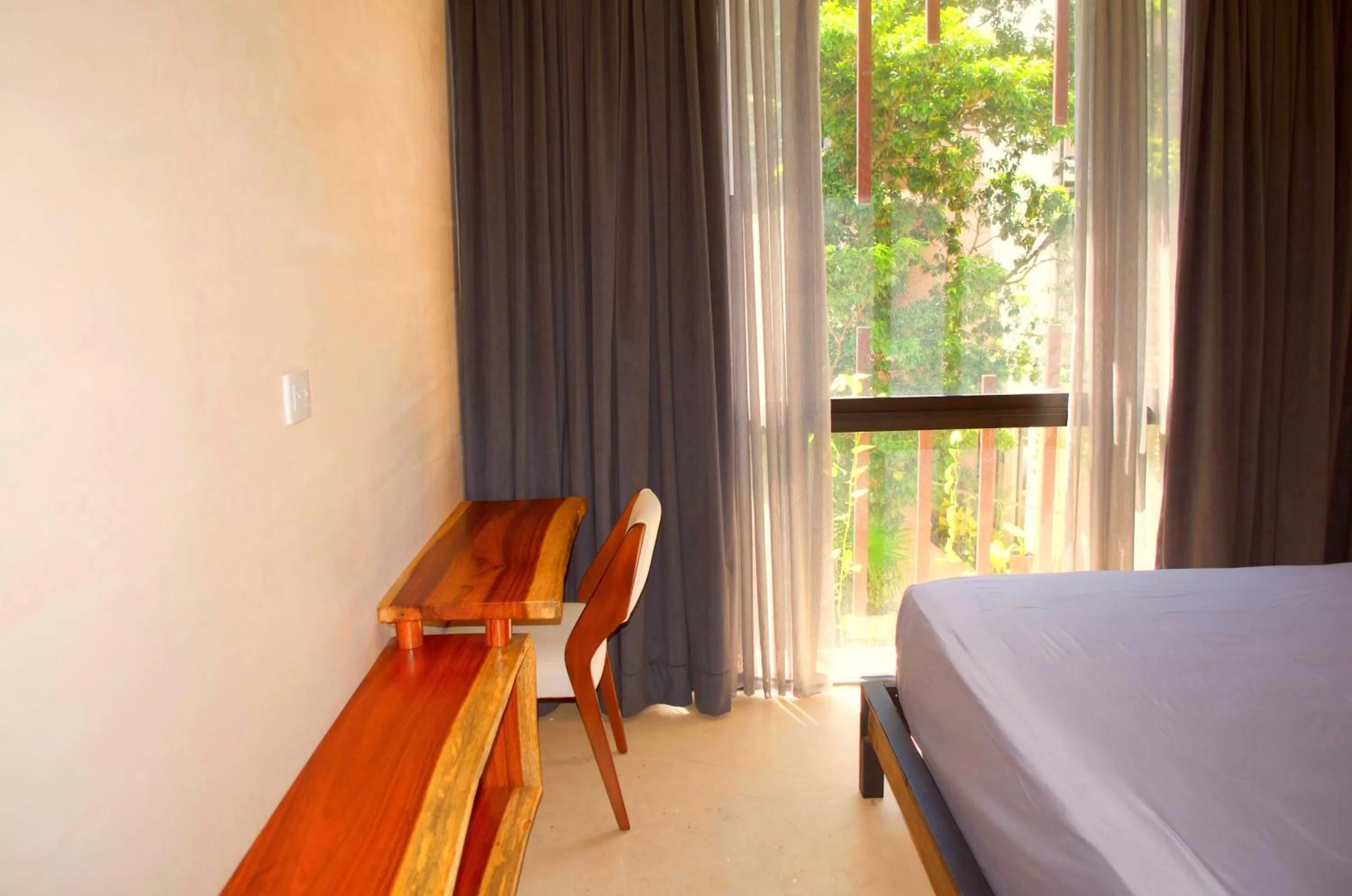 Bed in Gardens Coba - Luxury Cardinal