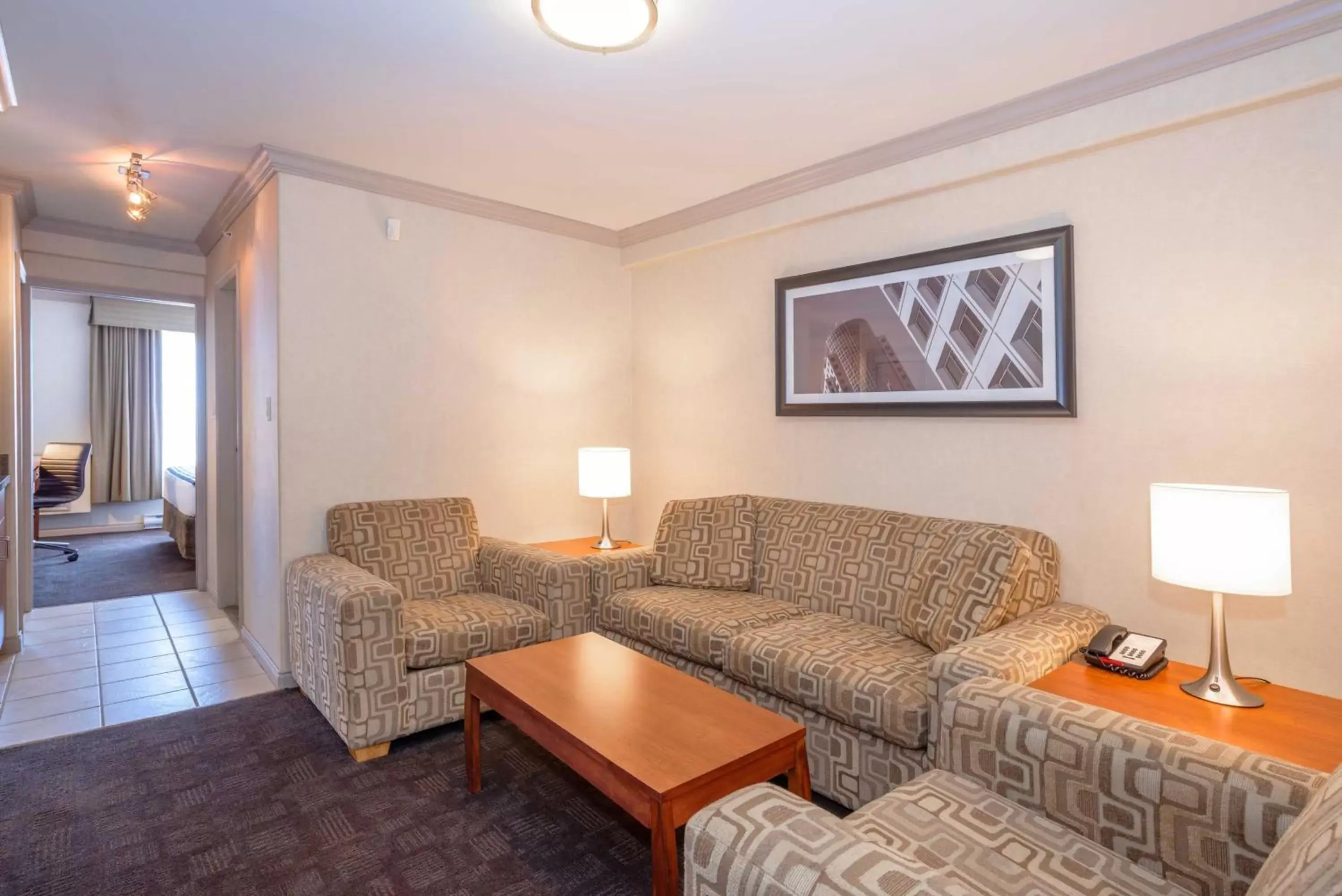 Photo of the whole room, Seating Area in Sandman Hotel & Suites Winnipeg Airport