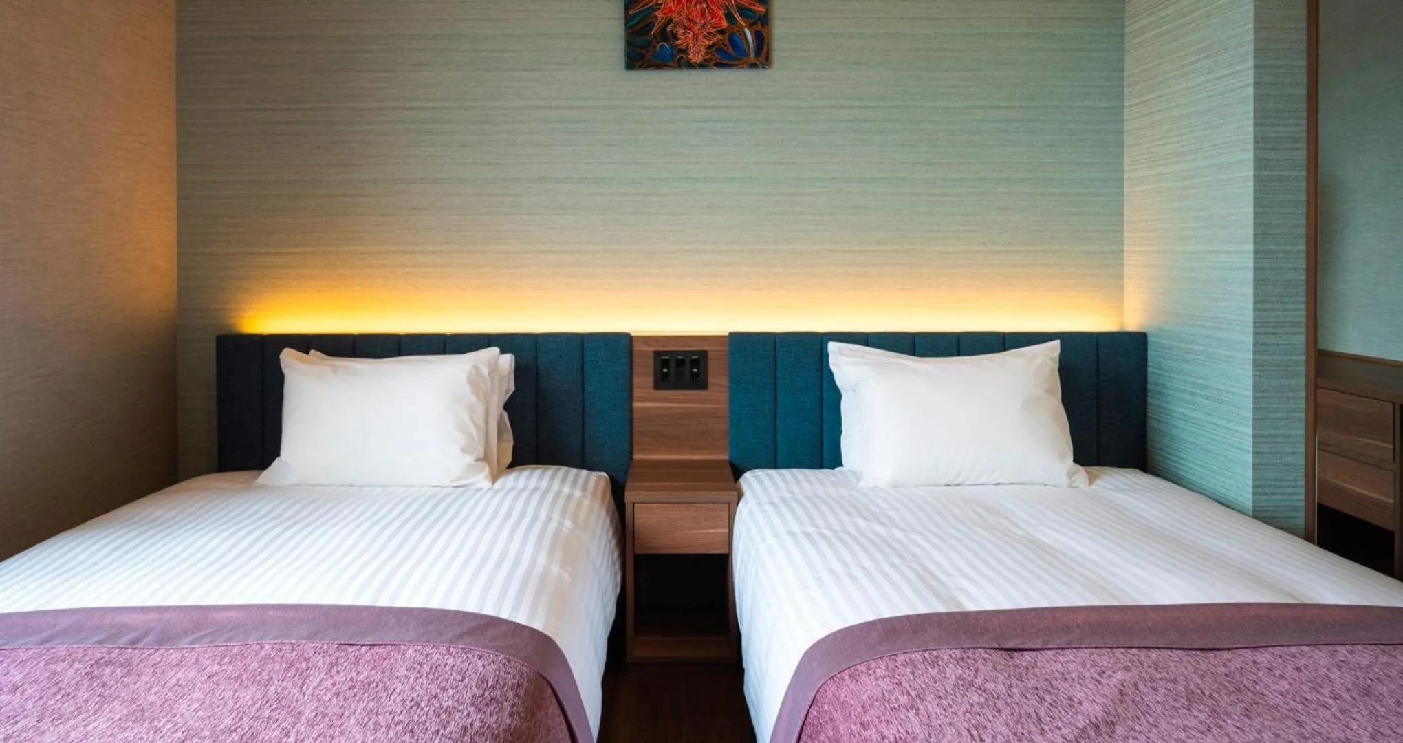 Bed in HOTEL SANSUI NAHA Ryukyu Onsen Naminoue-No-Yu