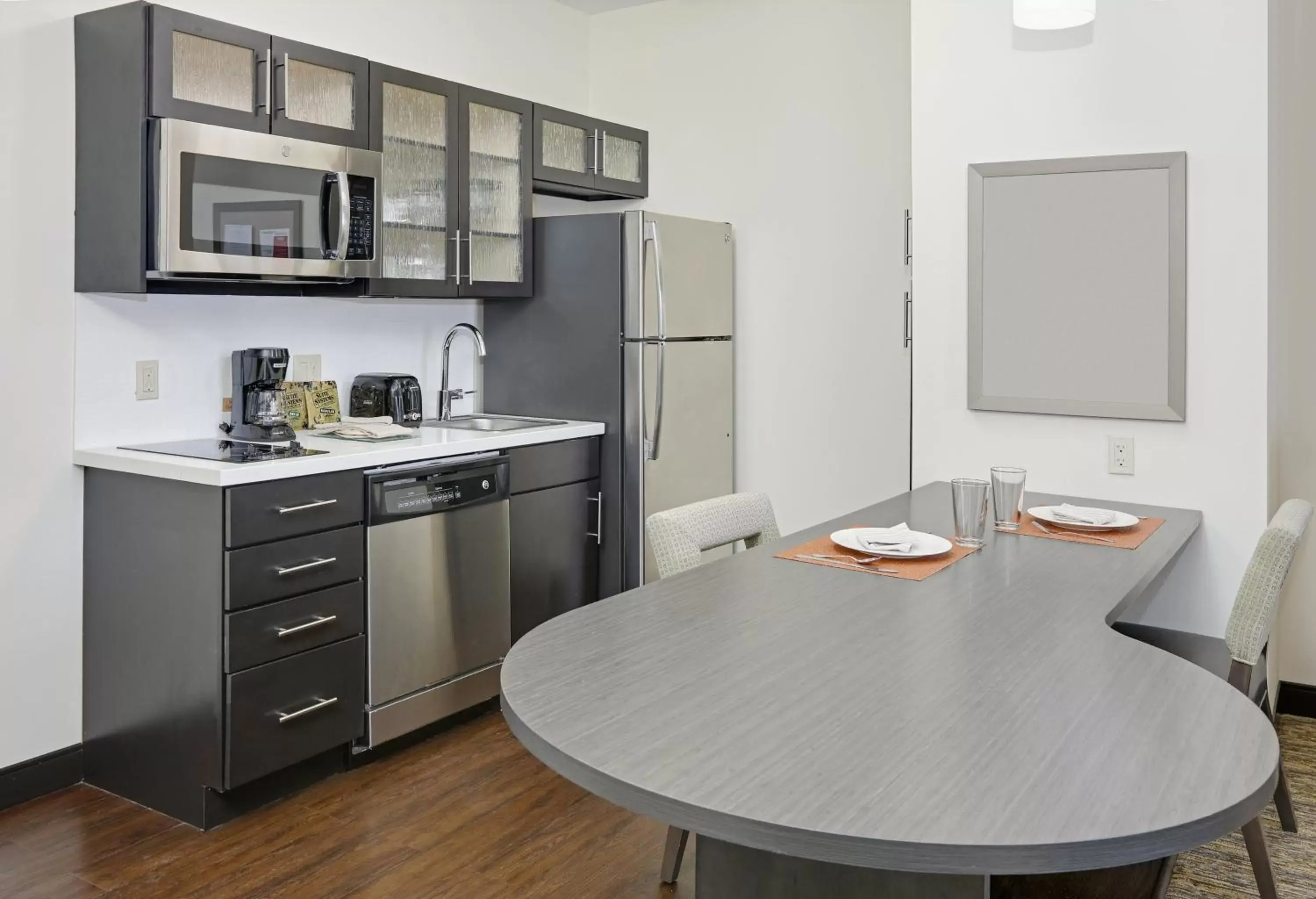 Photo of the whole room, Kitchen/Kitchenette in Candlewood Suites - Farmers Branch, an IHG Hotel