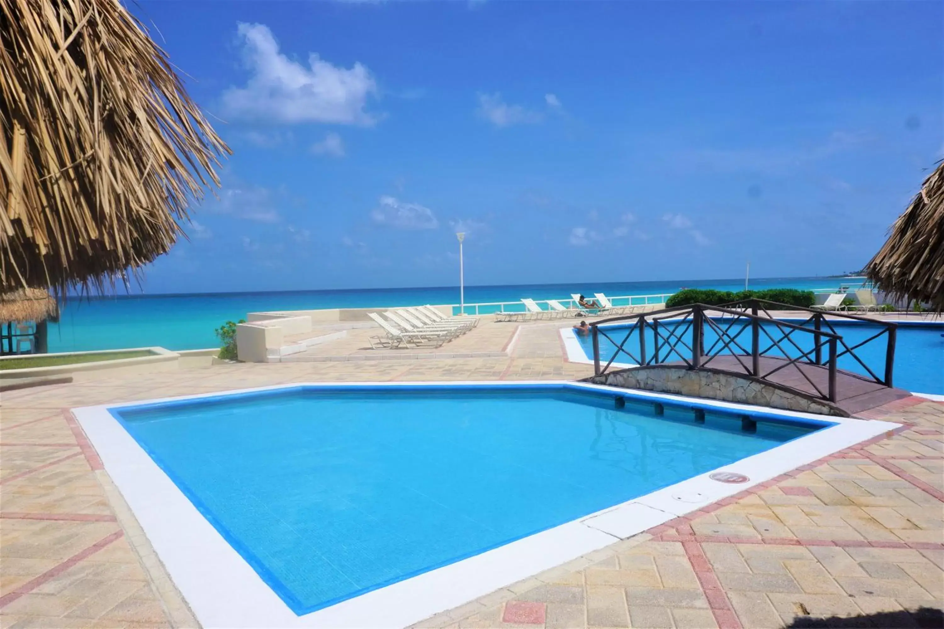 Pool view, Swimming Pool in Beachfront Penthouses by LivIN Cancun