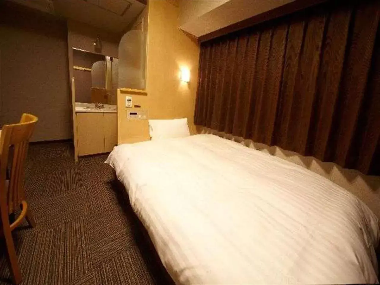 Bed in Dormy Inn Hiroshima