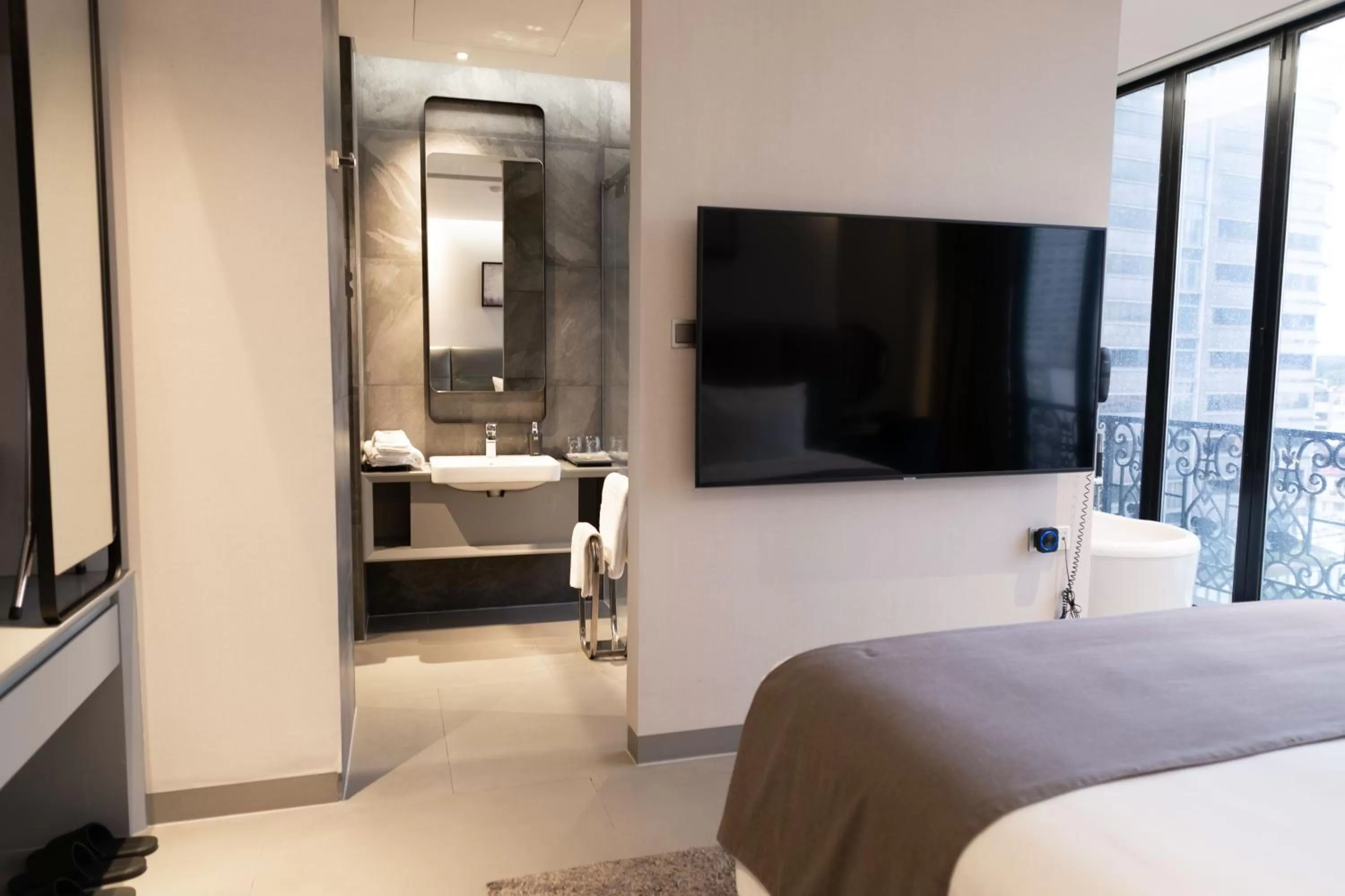 Bathroom, Bed in M Hotel Saigon