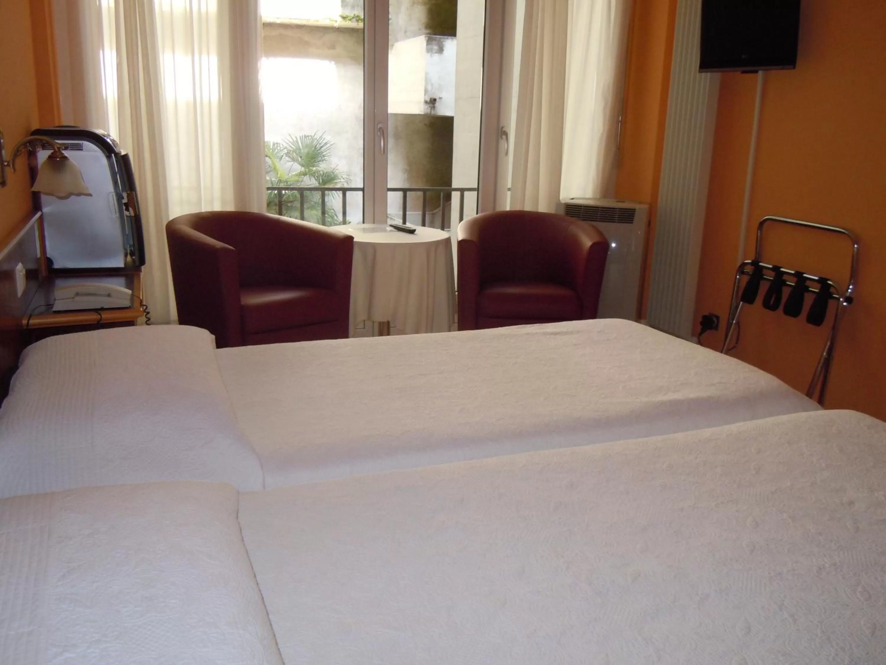 Bed in Swiss Lodge Nassa Garni