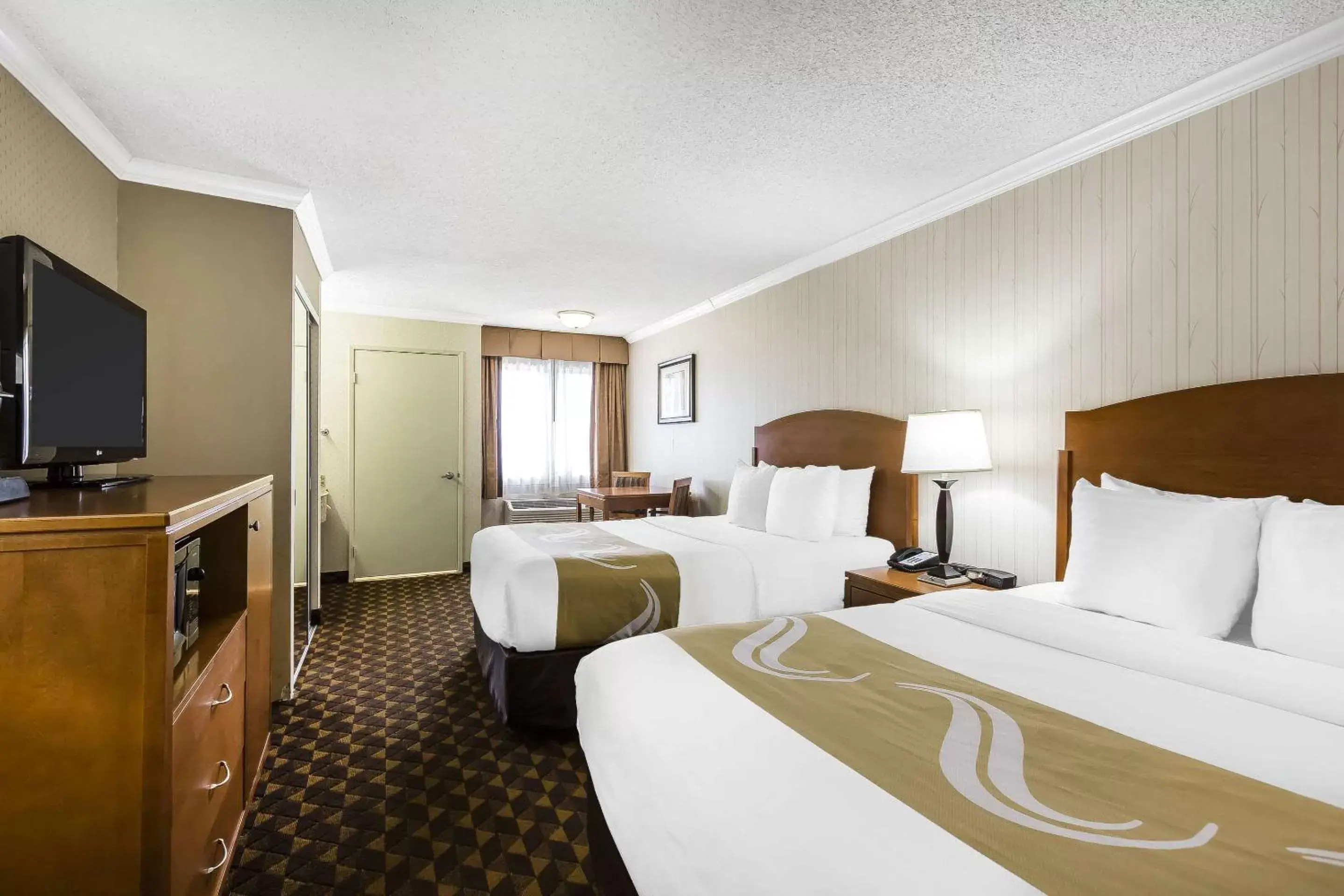 Photo of the whole room, Bed in Quality Inn & Suites Los Angeles Airport - LAX