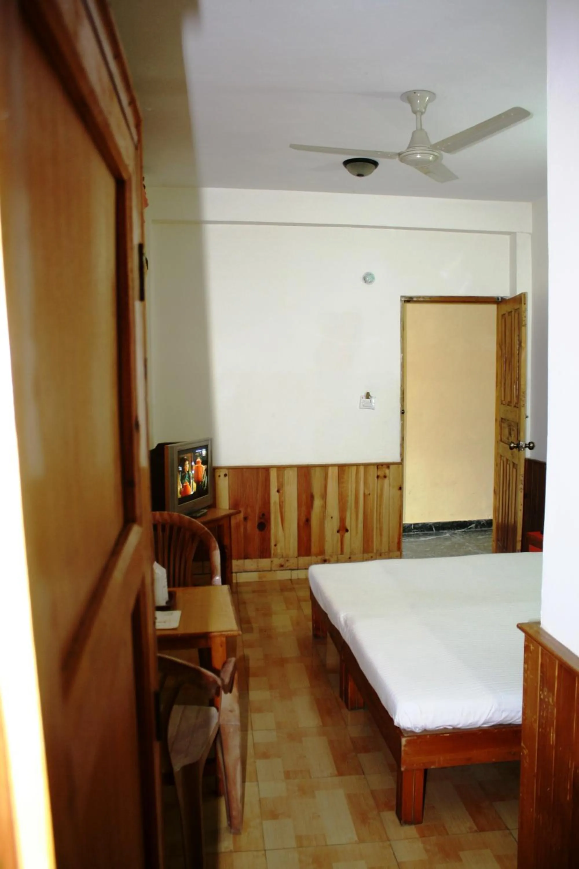 Bed, Dining Area in Sarthak Resorts-Reside in Nature with Best View, 9 kms from Mall Road Manali