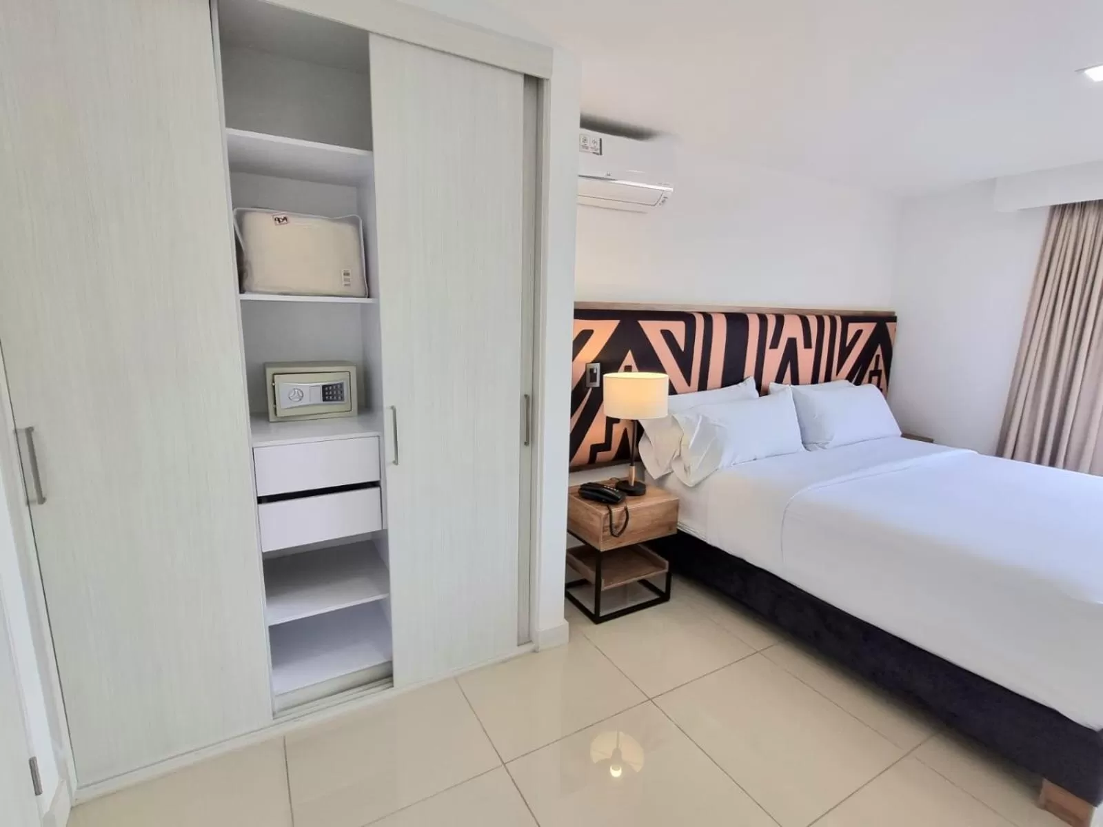 Bed in Origen Local Suites