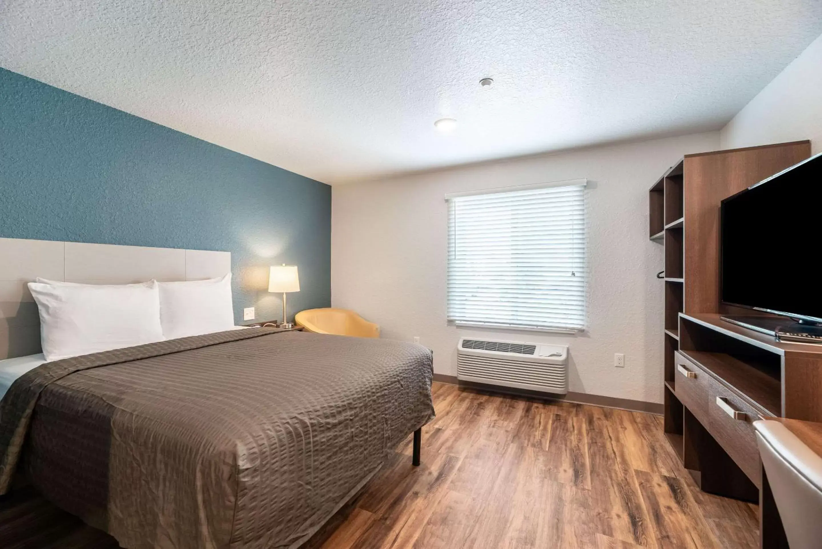 Photo of the whole room, Bed in WoodSpring Suites Sanford North I-4 Orlando Area