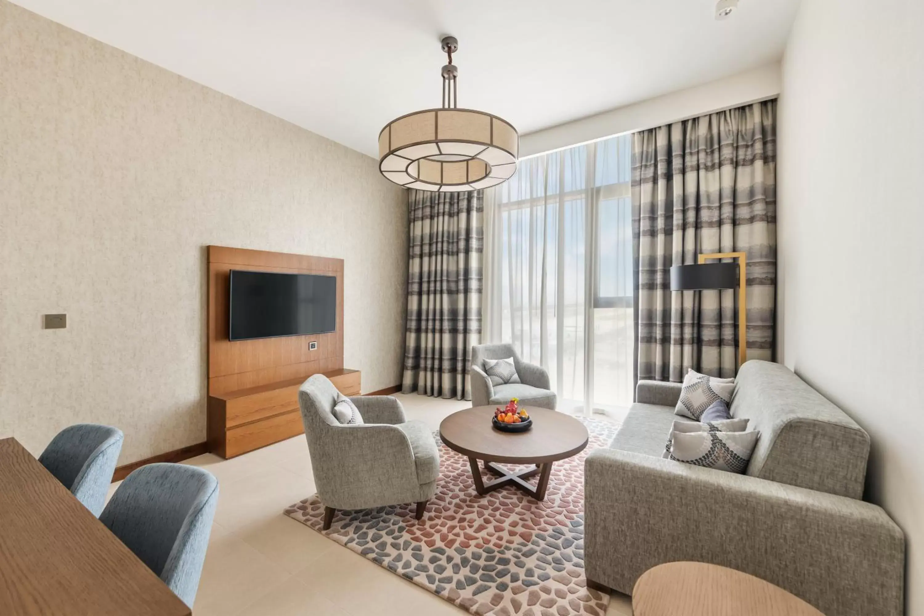 Living room, Seating Area in Staybridge Suites Dubai Al-Maktoum Airport, an IHG Hotel