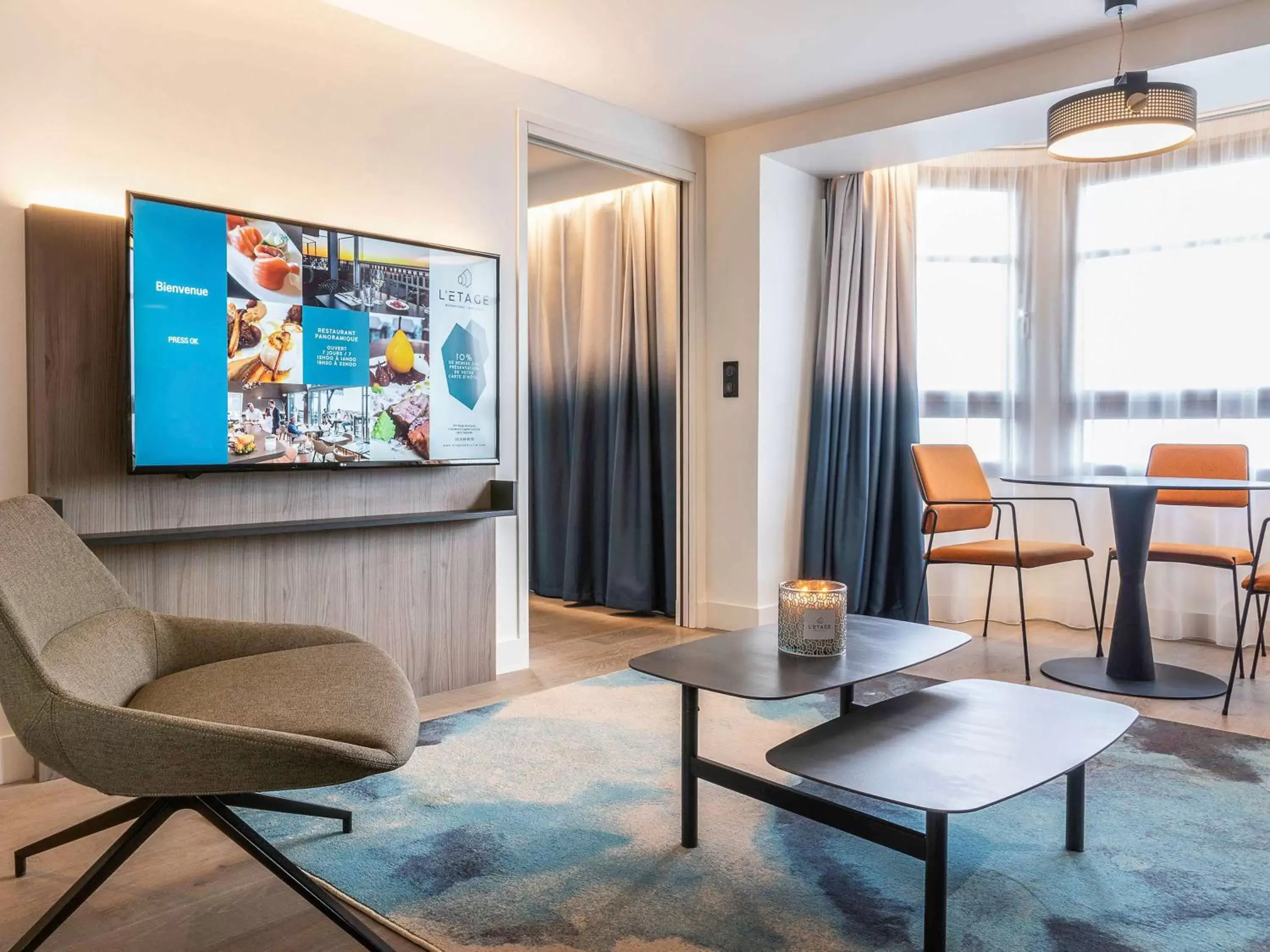 Photo of the whole room, TV/Entertainment Center in Novotel Deauville Plage