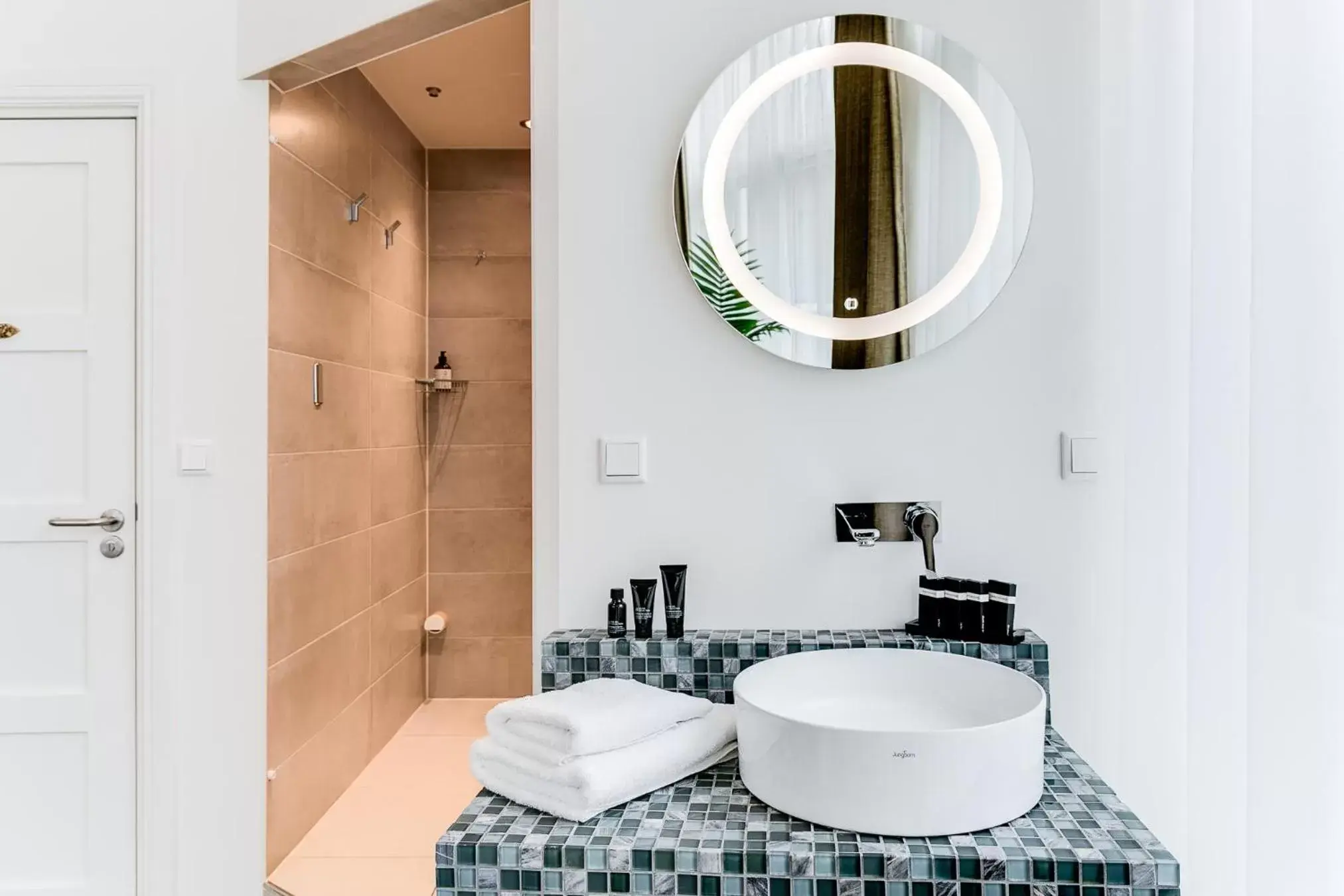 Bathroom in Brasss Hotel Suites