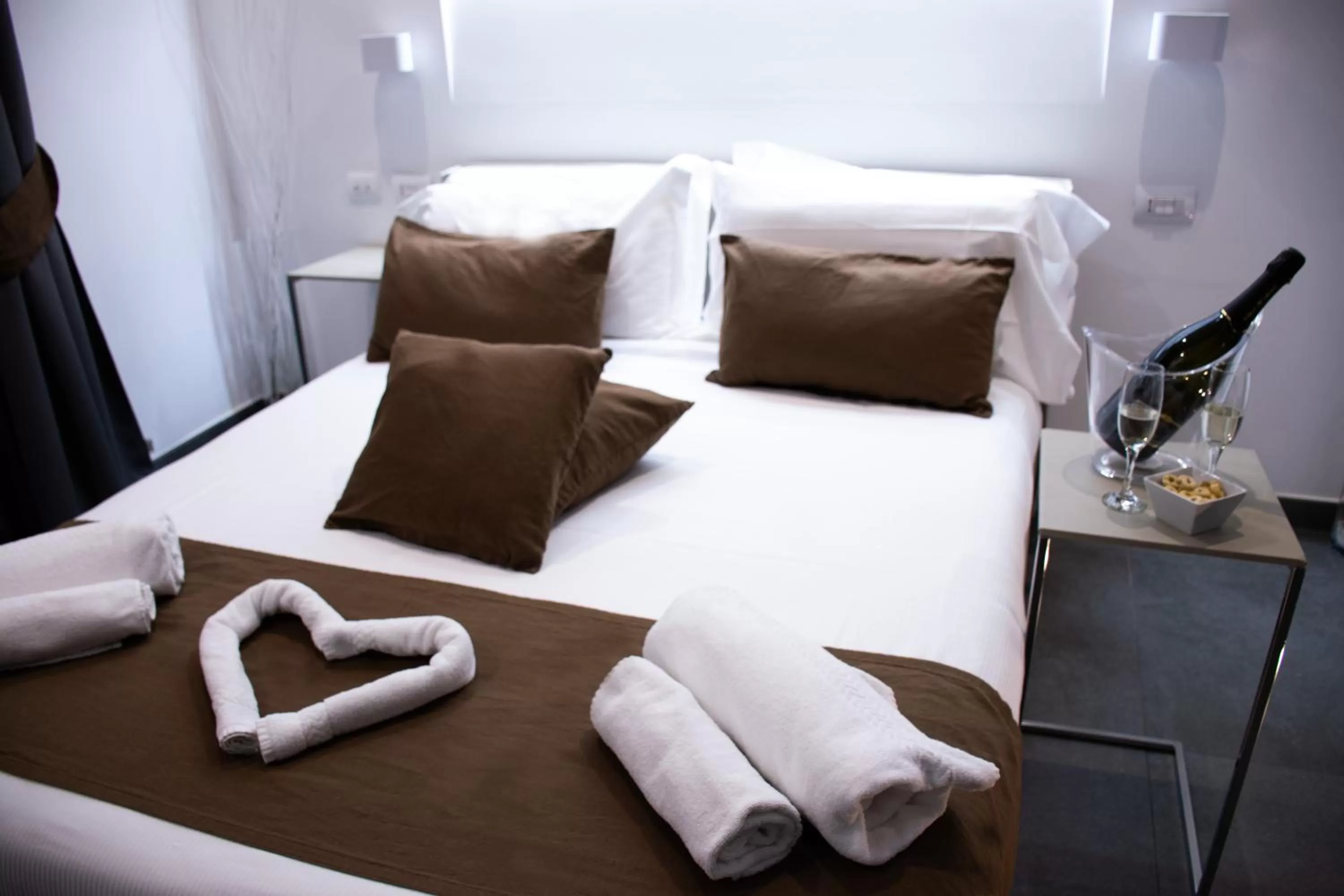 Bed in Megaris Luxury Suite Rooms