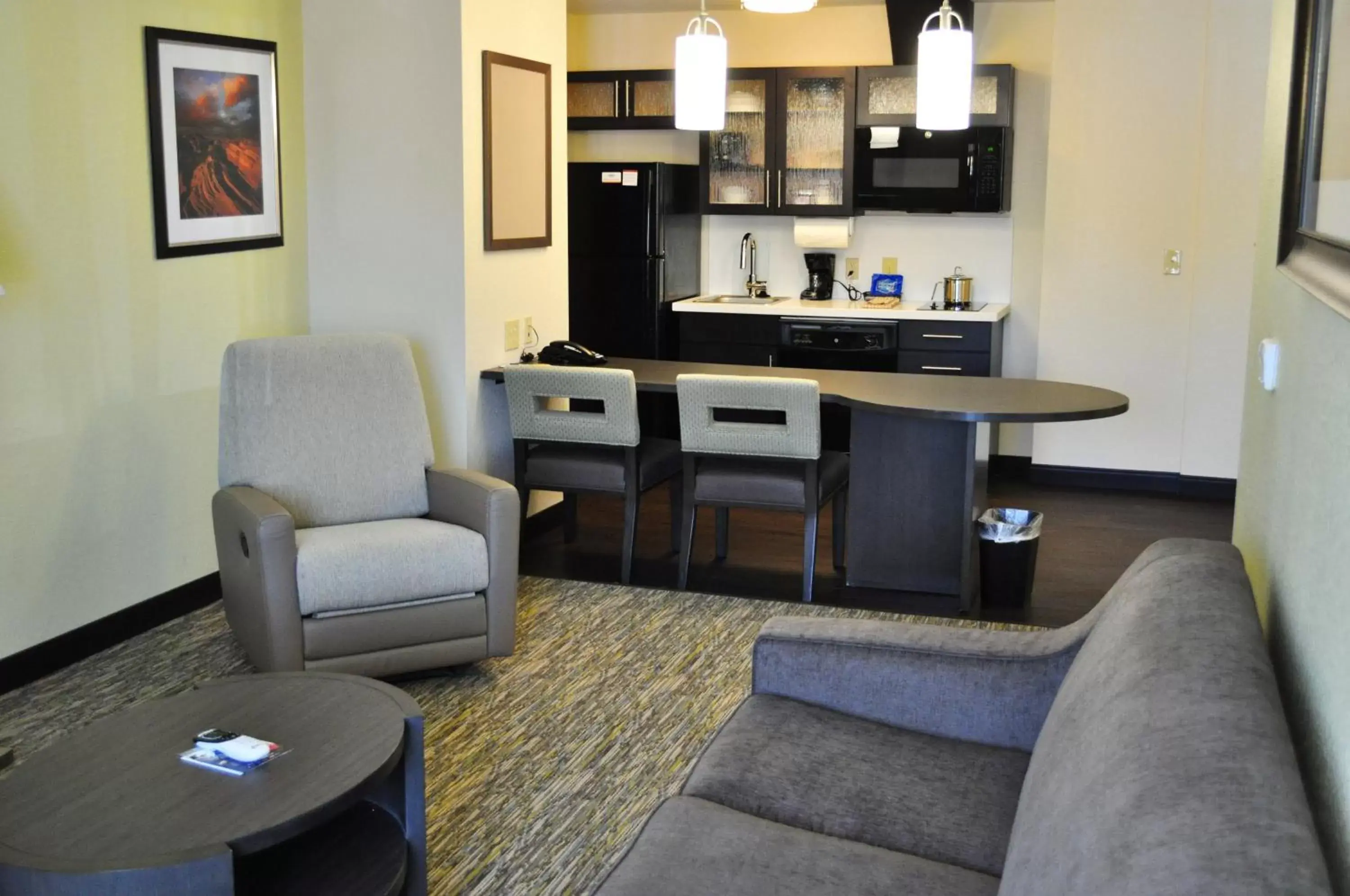 Photo of the whole room, Seating Area in Candlewood Suites Bay City, an IHG Hotel