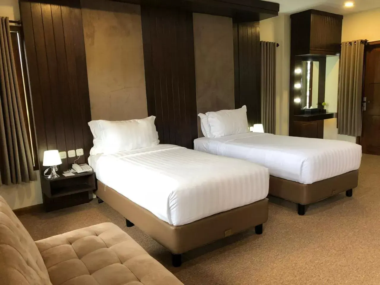 Bed in Grand Harvest Resort & Villas