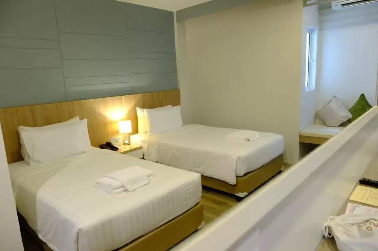 Bed in P21 Chiangmai Hotel Bed in P21 Chiangmai Hotel