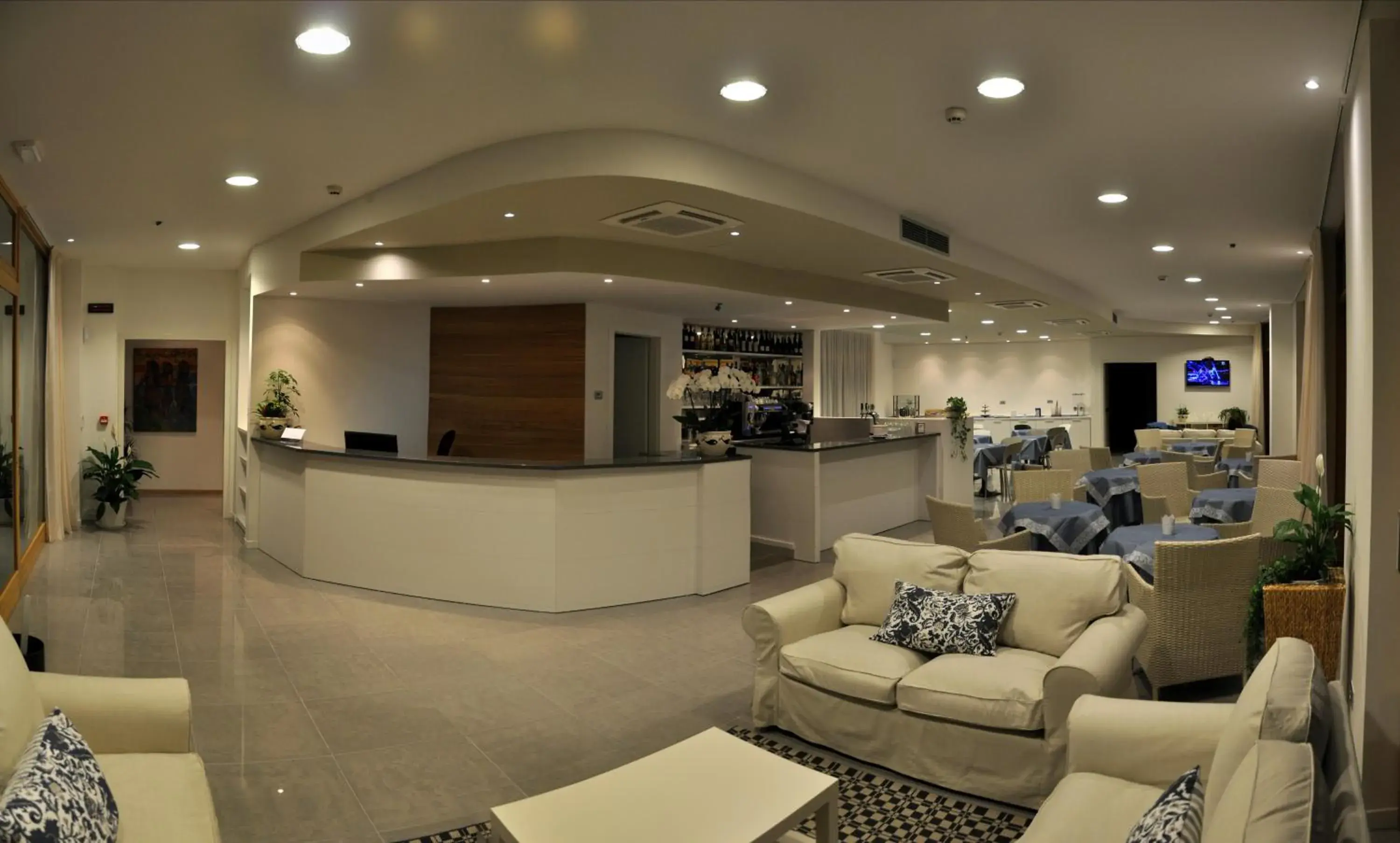 Communal lounge/ TV room, Lobby/Reception in Tullio Hotel