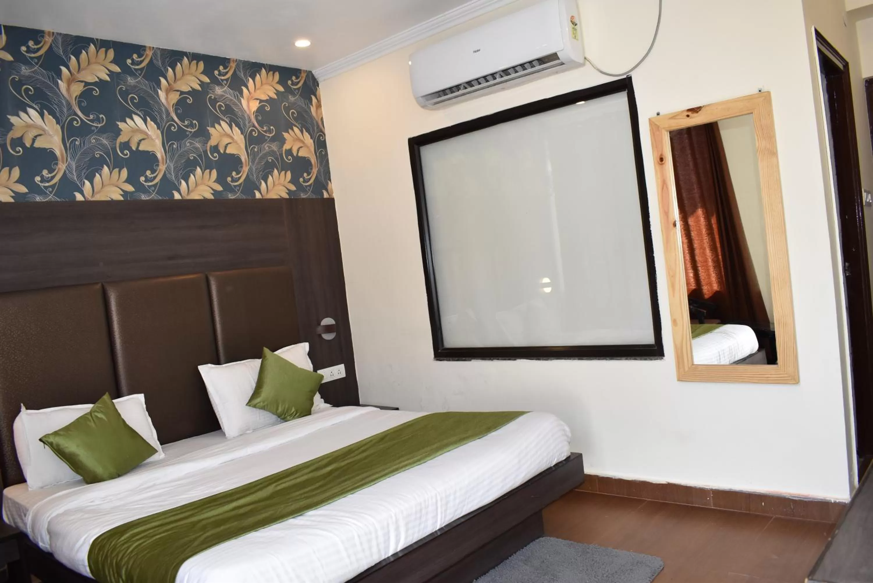 Bed in Tapasthali by Meera Hotels